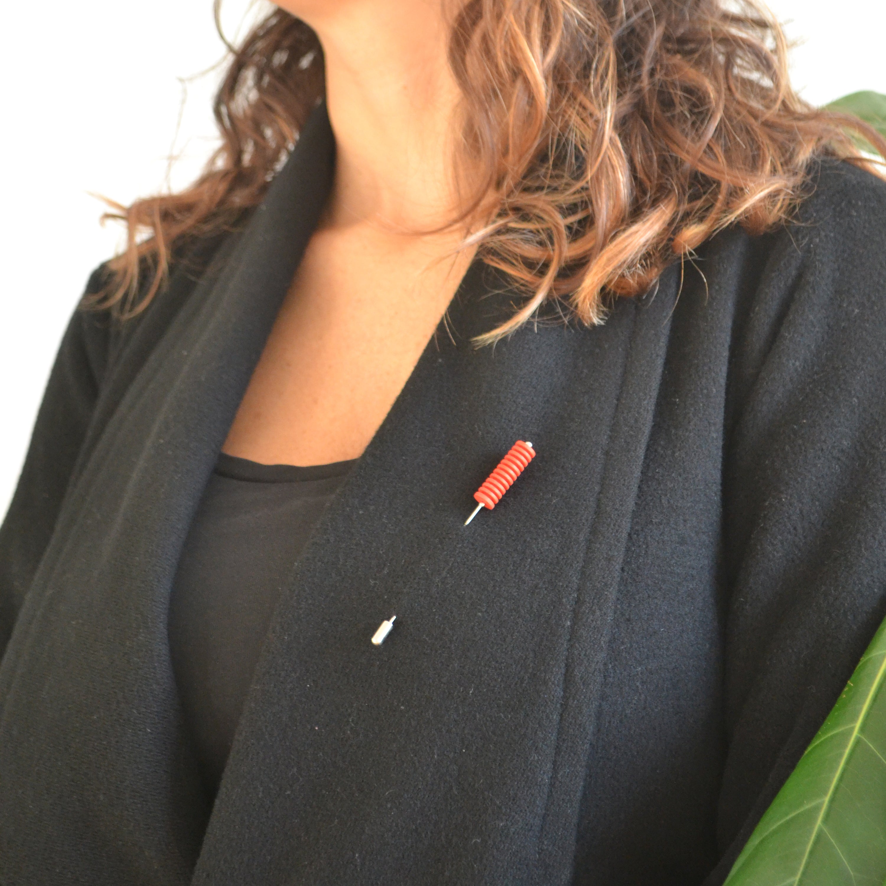 Optical Pin Brooch in various bold colors, showcasing its minimalistic design and versatility as a fashion accessory.