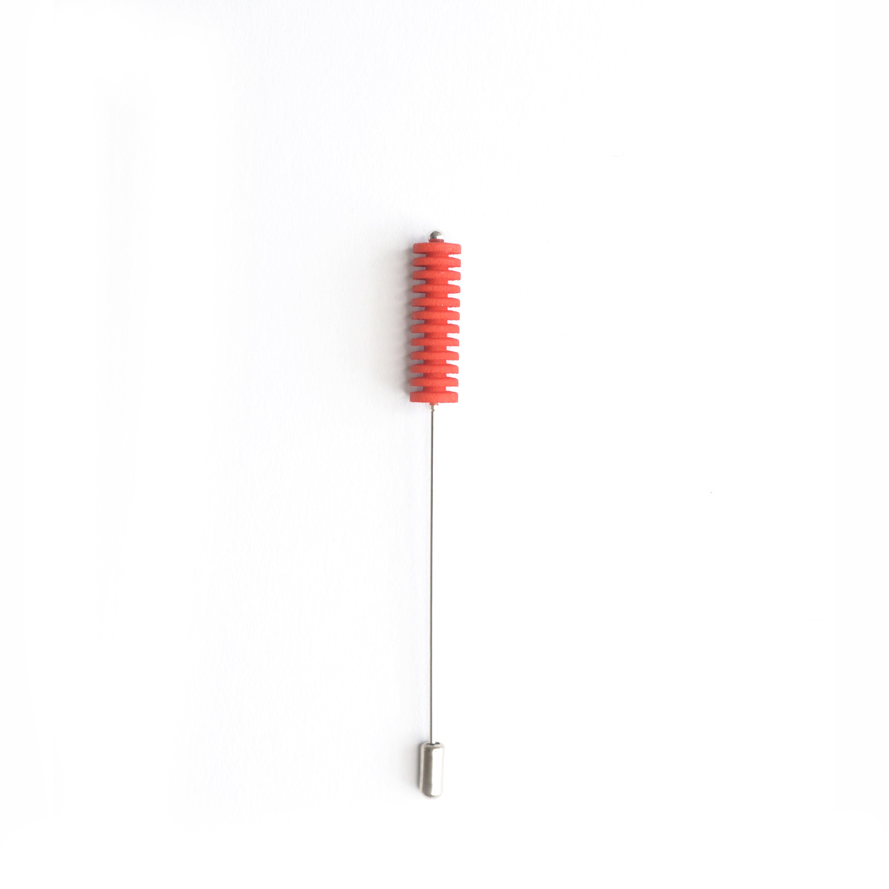 Optical Pin Brooch in various bold colors, showcasing its minimalistic design and versatility as a fashion accessory.