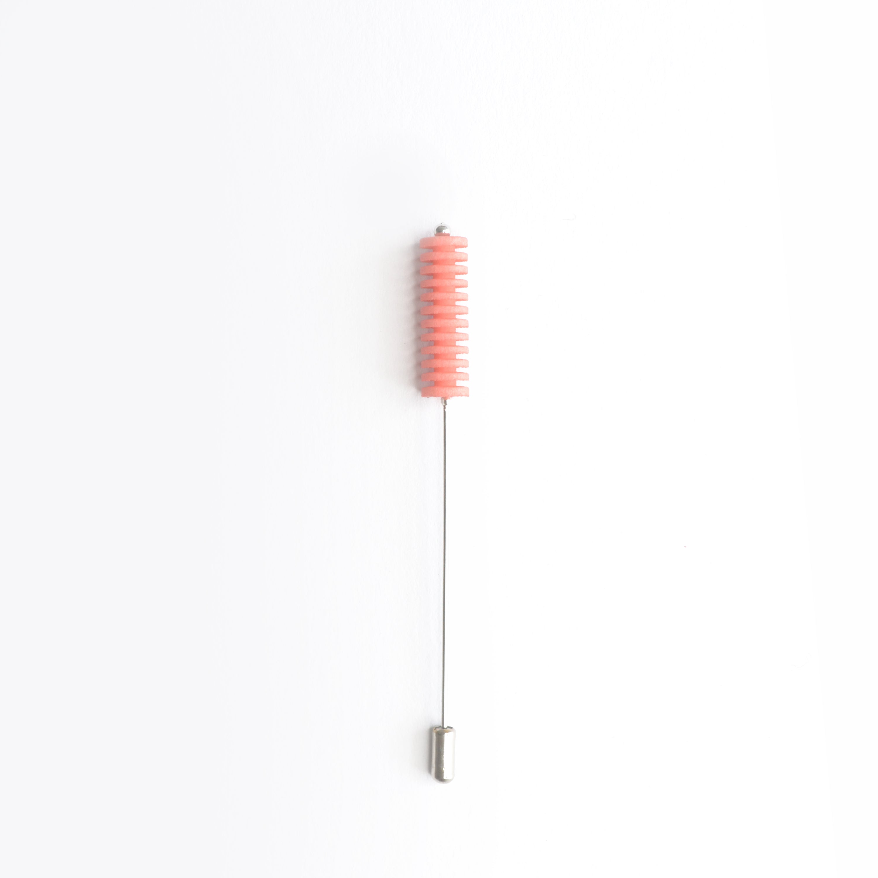 Optical Pin Brooch in various bold colors, showcasing its minimalistic design and versatility as a fashion accessory.