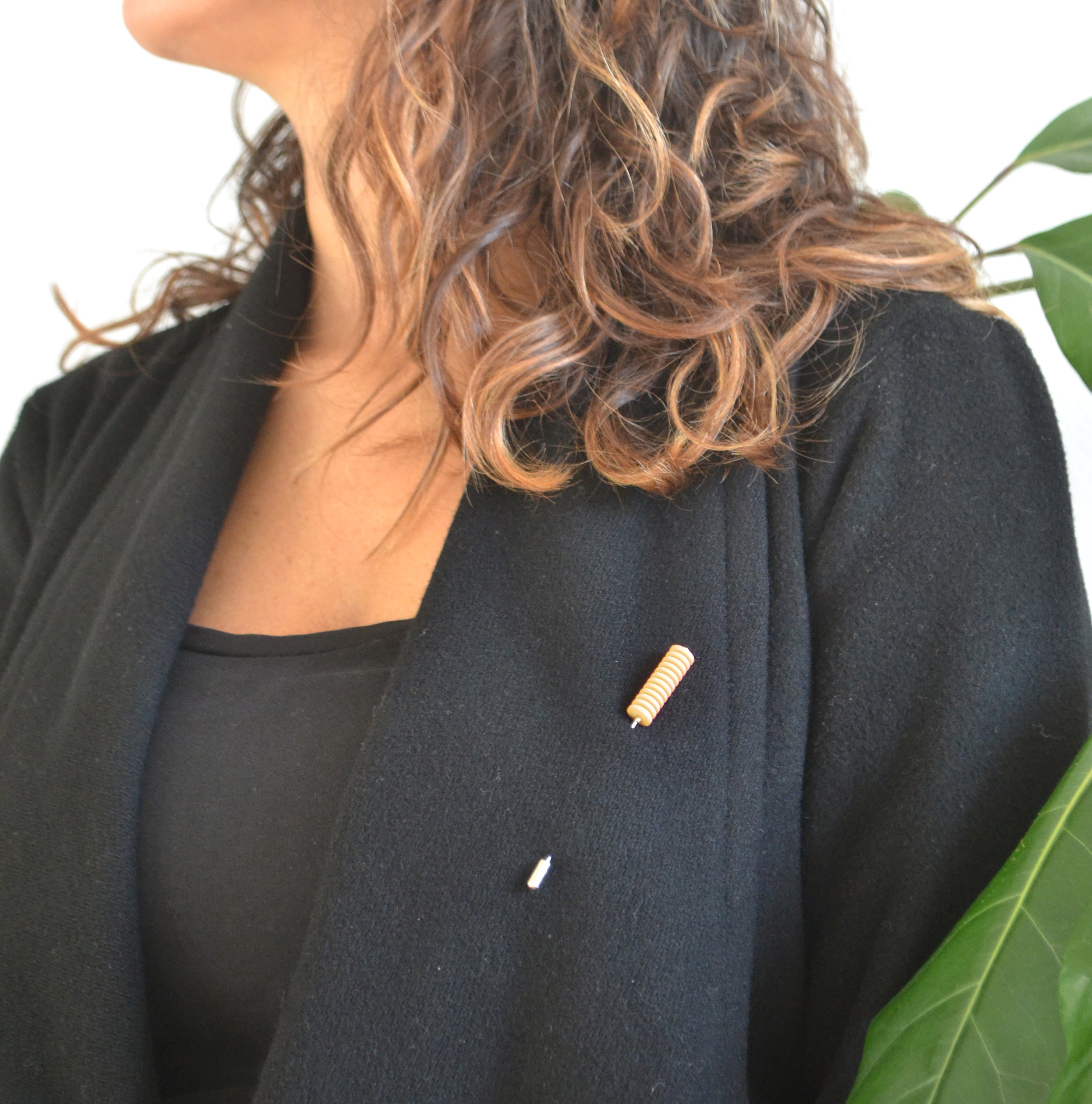 Optical Pin Brooch in various bold colors, showcasing its minimalistic design and versatility as a fashion accessory.