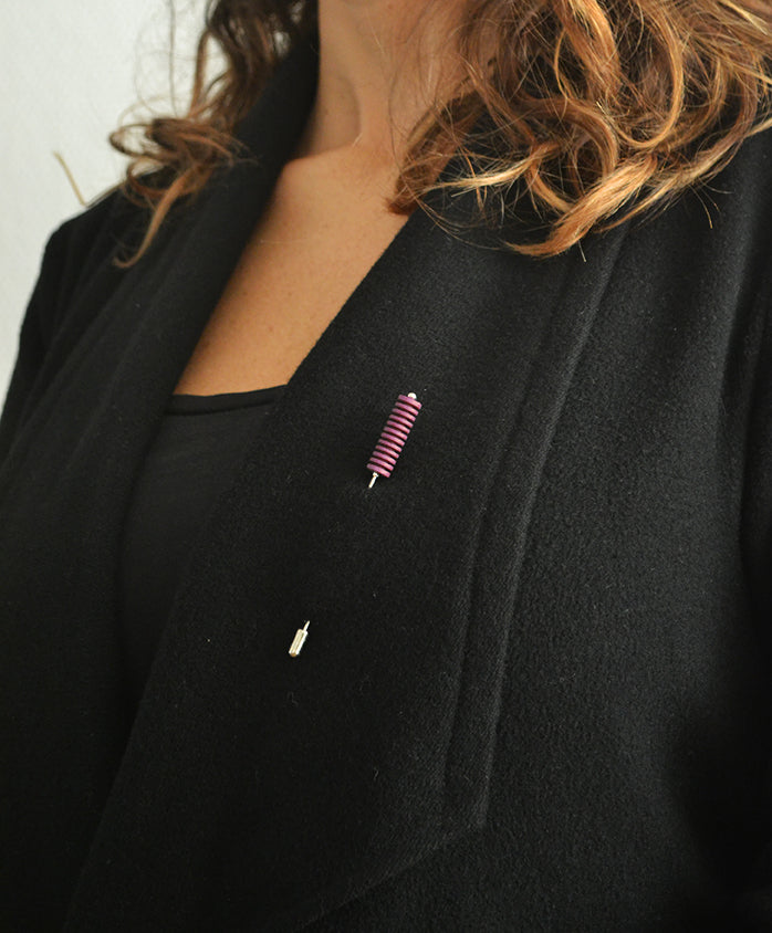 Optical Pin Brooch in various bold colors, showcasing its minimalistic design and versatility as a fashion accessory.