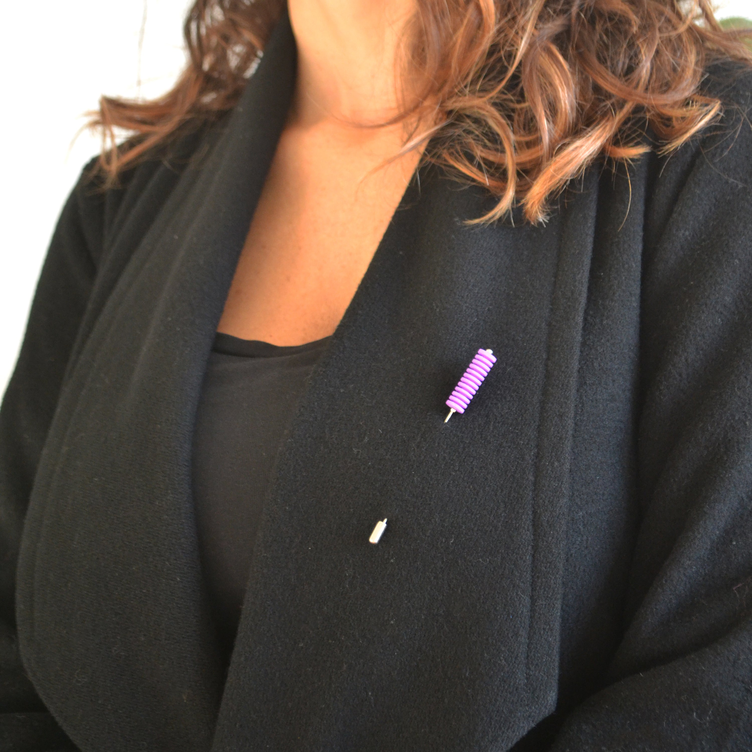 Optical Pin Brooch in various bold colors, showcasing its minimalistic design and versatility as a fashion accessory.