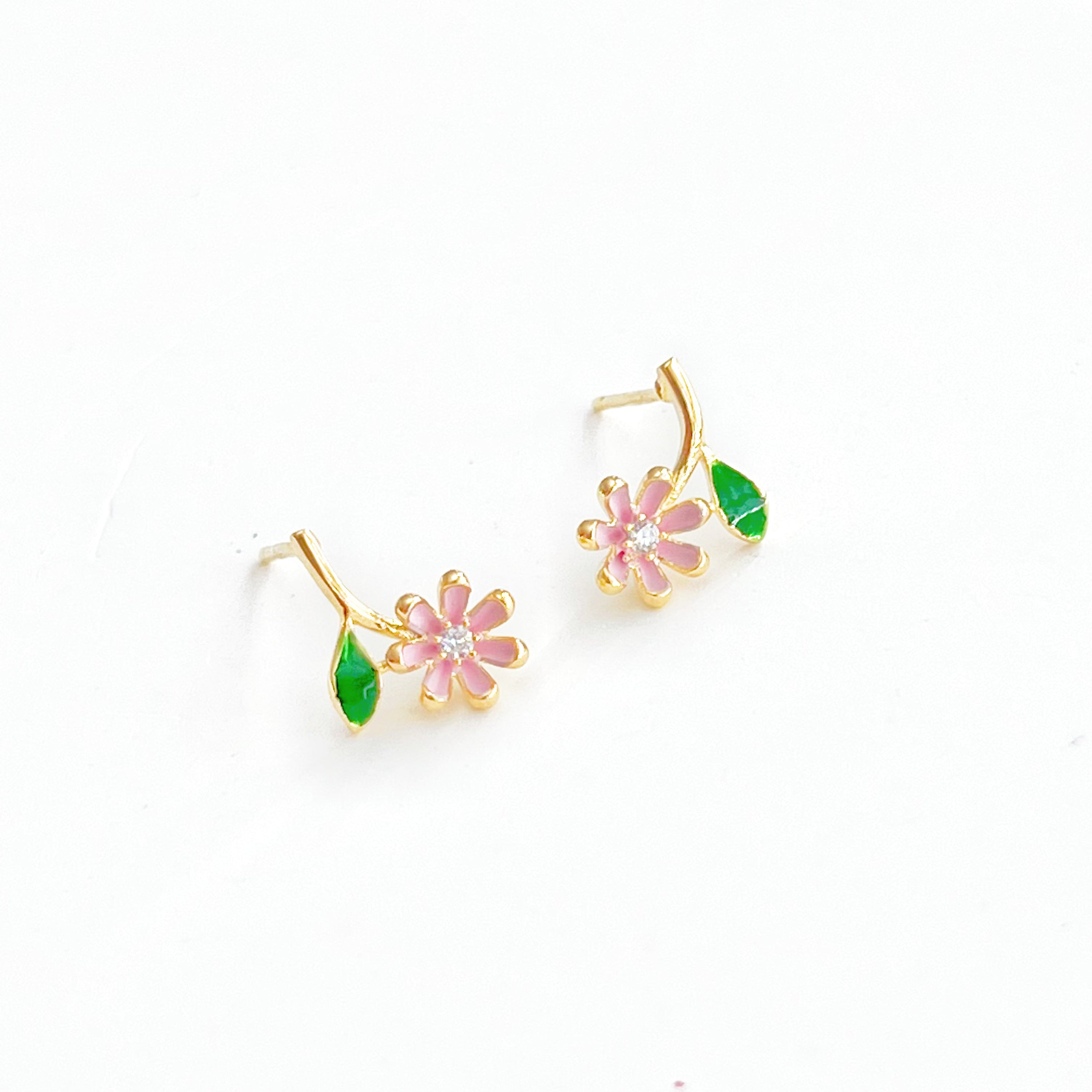 A pair of Pink Little Wildflower Earrings featuring gold plated bronze and sterling silver, elegantly designed with glass crystals.