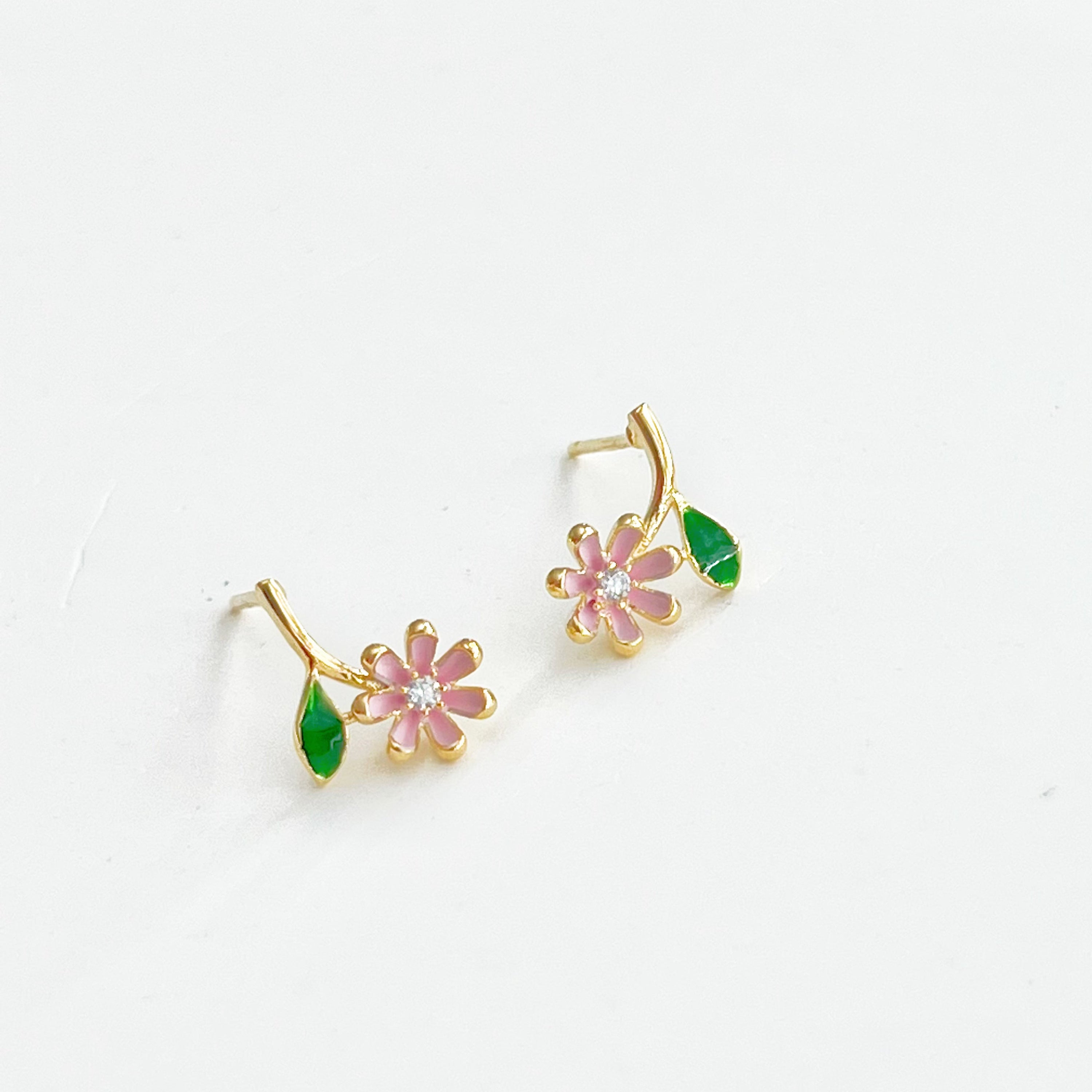 A pair of Pink Little Wildflower Earrings featuring gold plated bronze and sterling silver, elegantly designed with glass crystals.