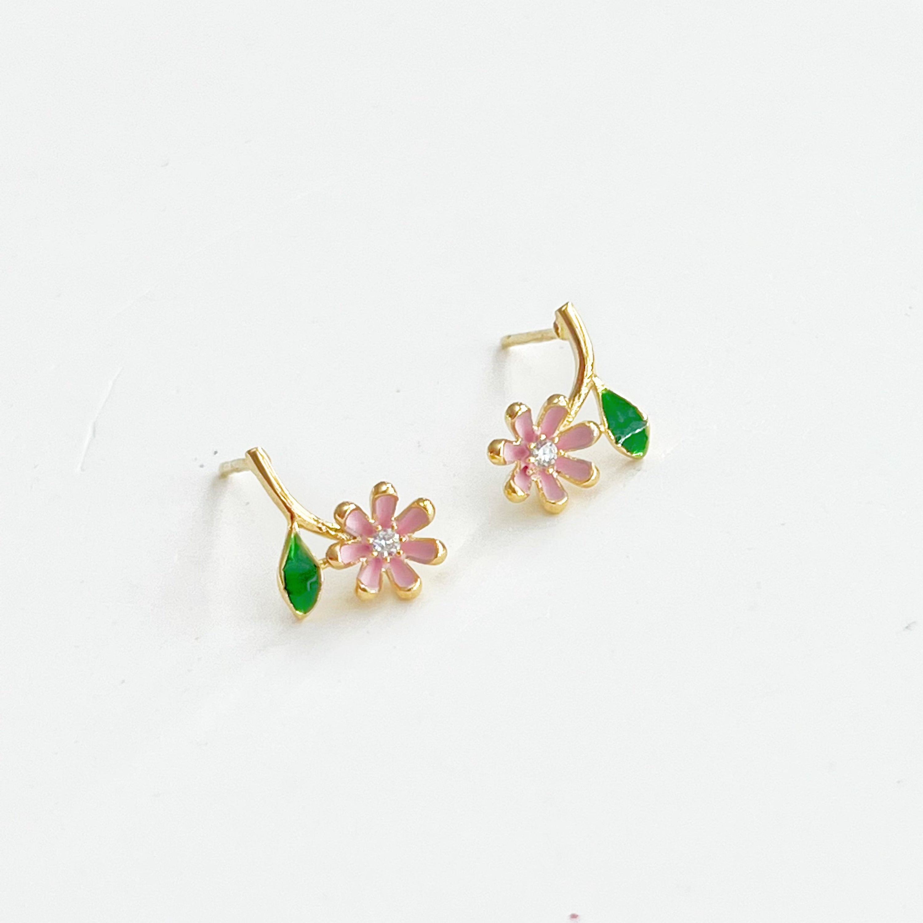 A pair of Pink Little Wildflower Earrings featuring gold plated bronze and sterling silver, elegantly designed with glass crystals.