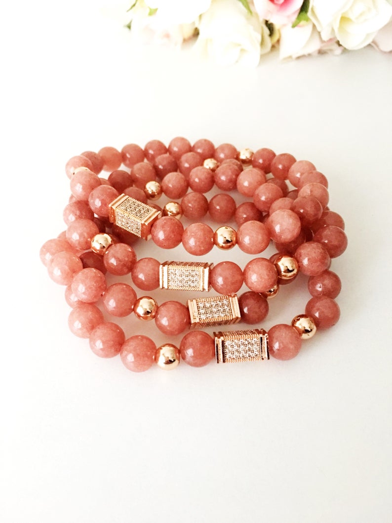 A beautiful pink opal bracelet featuring 8mm beads on a strong elastic cord, perfect for daily wear and emotional healing.