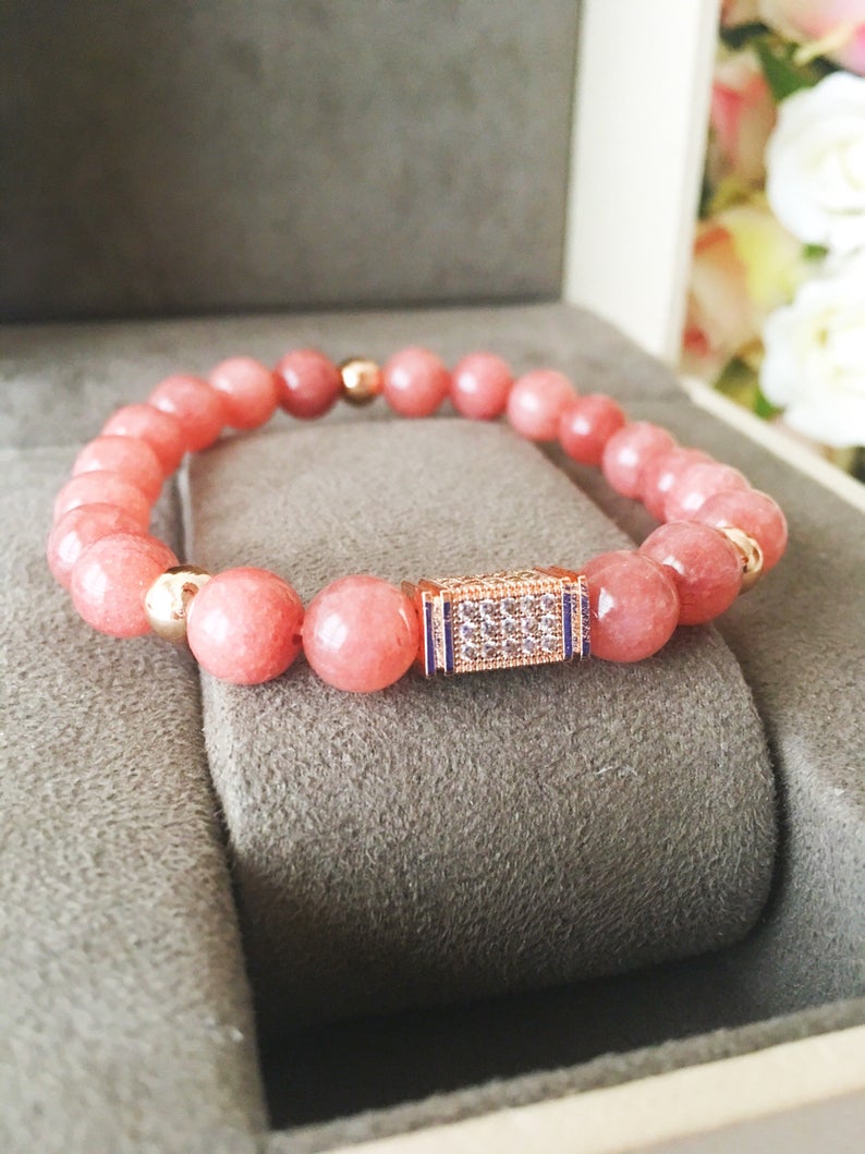 A beautiful pink opal bracelet featuring 8mm beads on a strong elastic cord, perfect for daily wear and emotional healing.