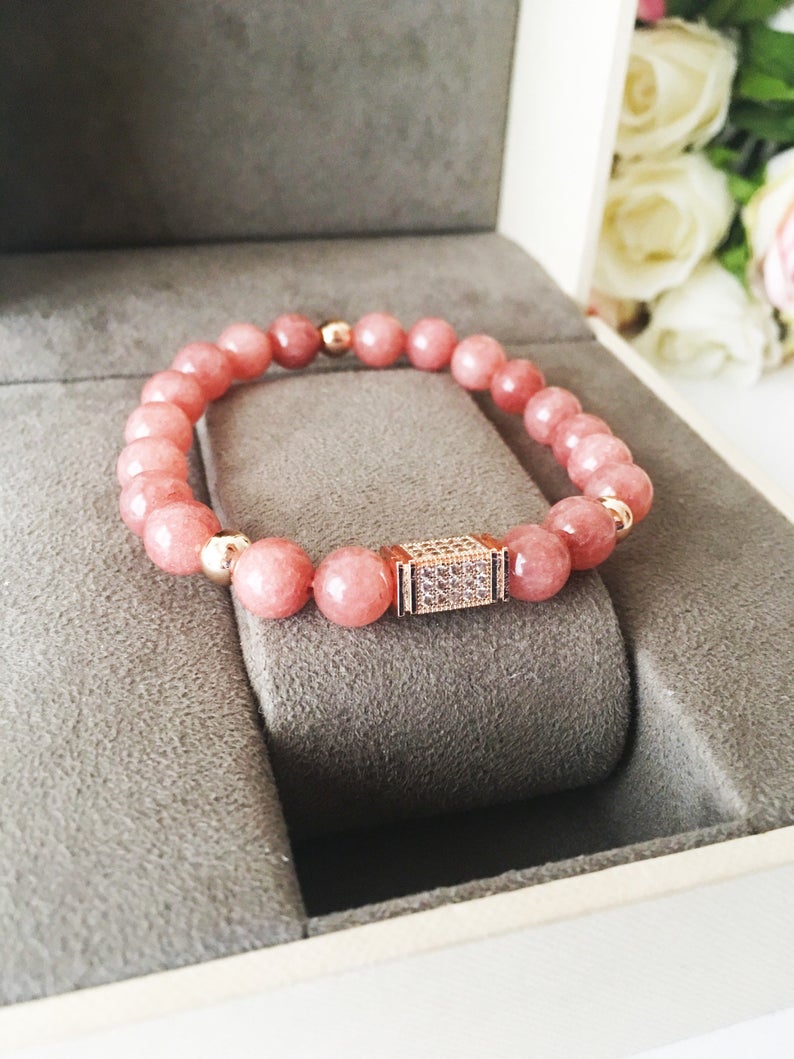 A beautiful pink opal bracelet featuring 8mm beads on a strong elastic cord, perfect for daily wear and emotional healing.