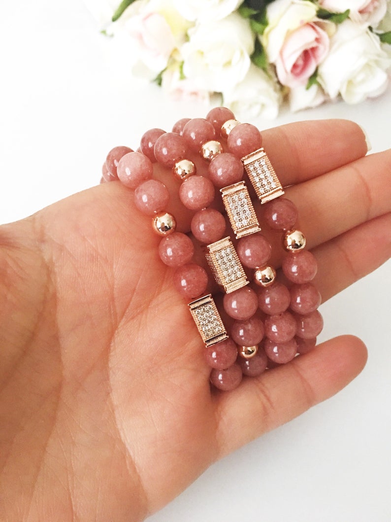 A beautiful pink opal bracelet featuring 8mm beads on a strong elastic cord, perfect for daily wear and emotional healing.