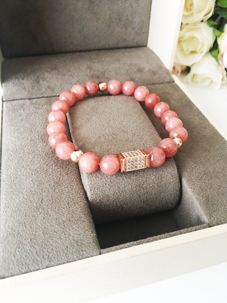 A beautiful pink opal bracelet featuring 8mm beads on a strong elastic cord, perfect for daily wear and emotional healing.