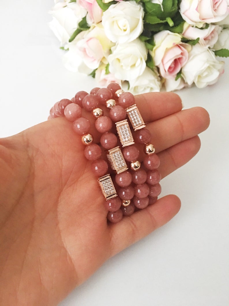 A beautiful pink opal bracelet featuring 8mm beads on a strong elastic cord, perfect for daily wear and emotional healing.