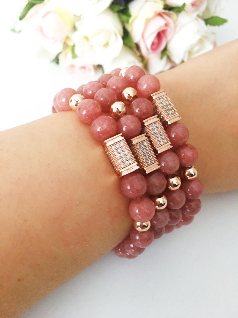 A beautiful pink opal bracelet featuring 8mm beads on a strong elastic cord, perfect for daily wear and emotional healing.