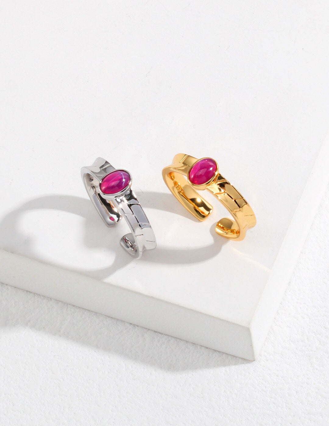 A stunning pink oval shaped zircon ring set in sterling silver with gold vermeil accents, showcasing its elegant design.