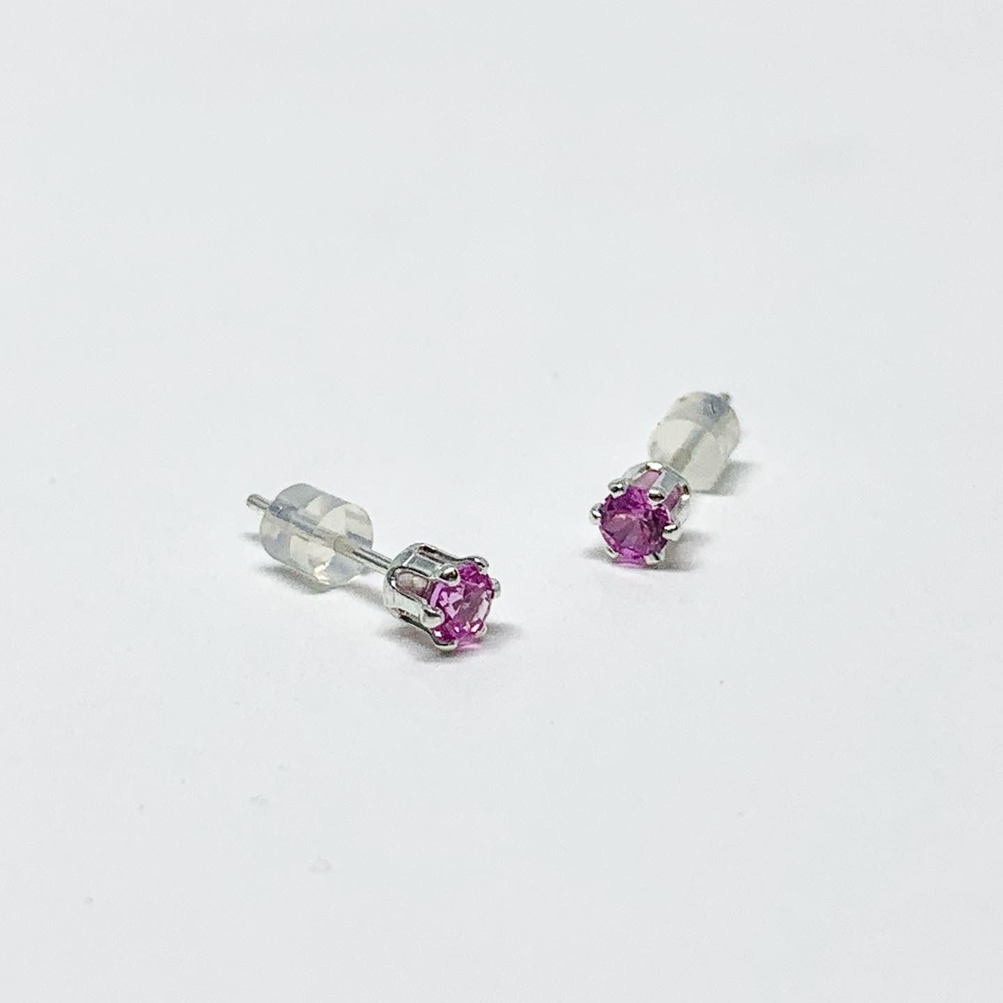 A pair of stunning pink tourmaline birthstone earrings set in sterling silver, featuring 3mm round faceted gemstones, perfect for October birthdays.