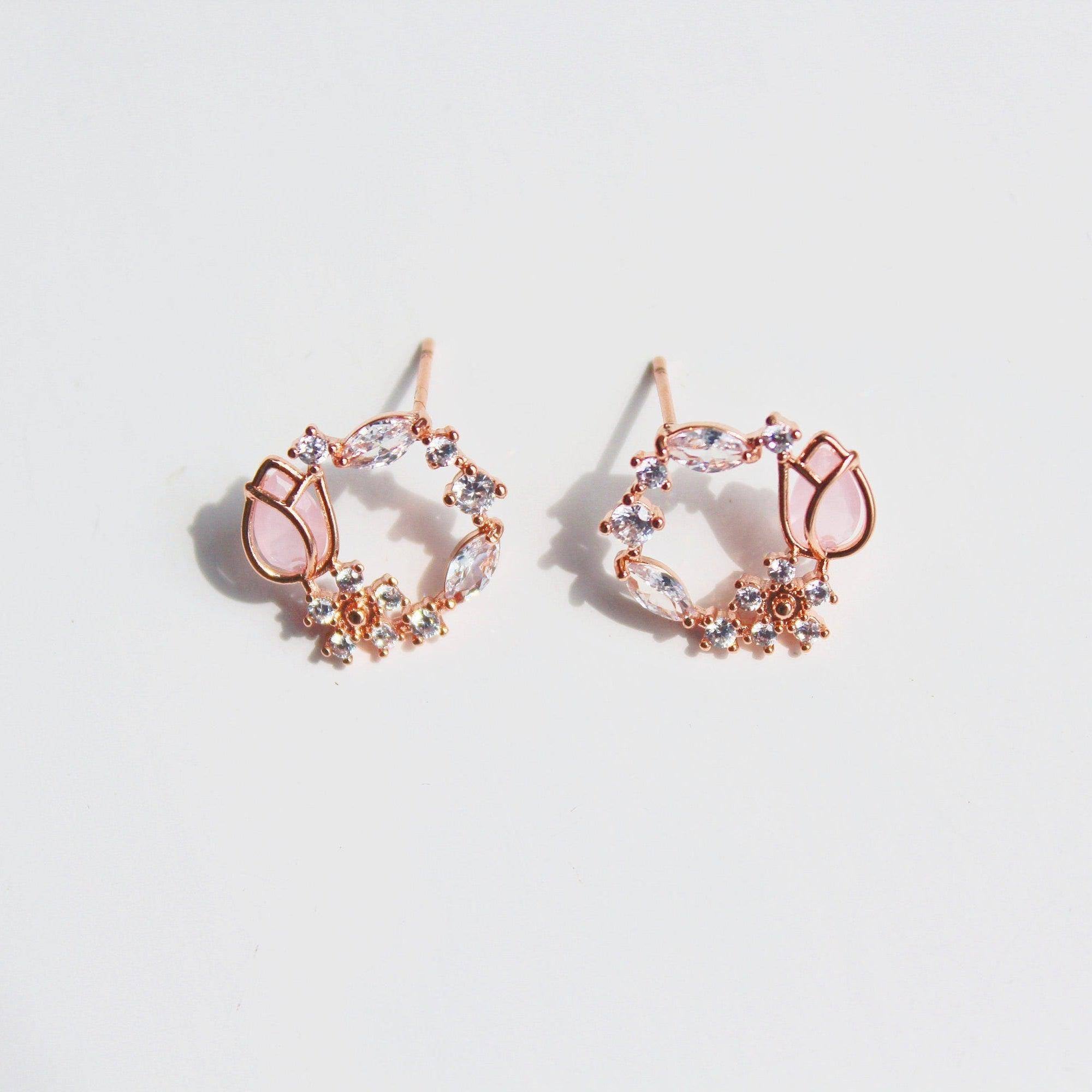 Elegant pink tulip earrings featuring flower-shaped crystal design in rose gold plating.