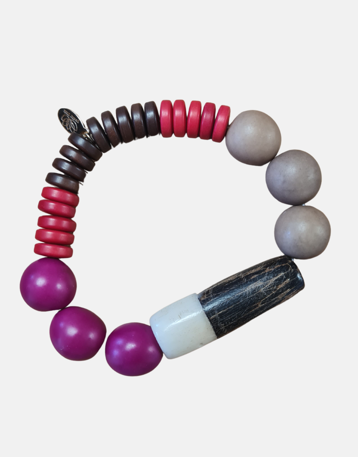 Pipa Bracelet - Berrie Crumble featuring tagua and wood design, showcasing its unique pipe-like shape.