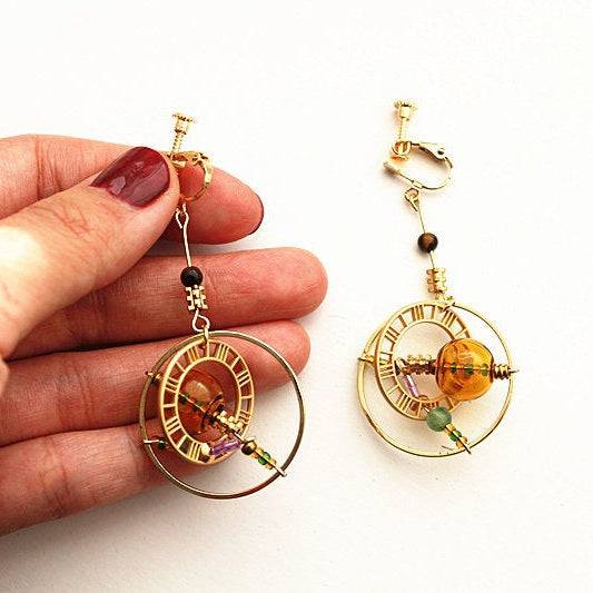 Elegant Planet Saturn Universe Theme Orb Shape Drop Earrings featuring glass orbs and gold-plated bronze, perfect for celestial-themed jewelry lovers.