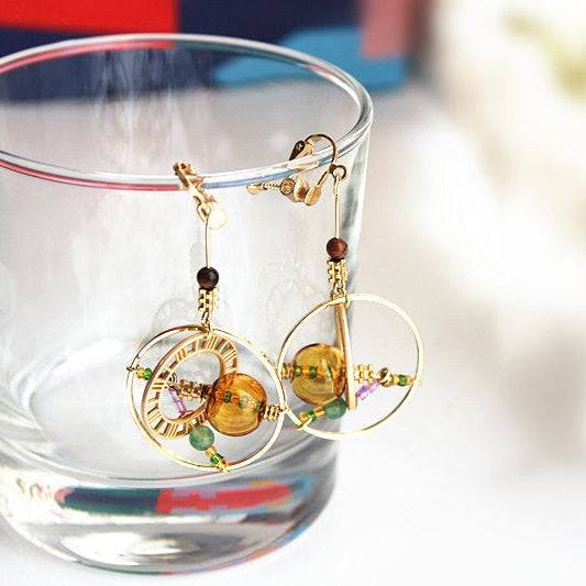 Elegant Planet Saturn Universe Theme Orb Shape Drop Earrings featuring glass orbs and gold-plated bronze, perfect for celestial-themed jewelry lovers.