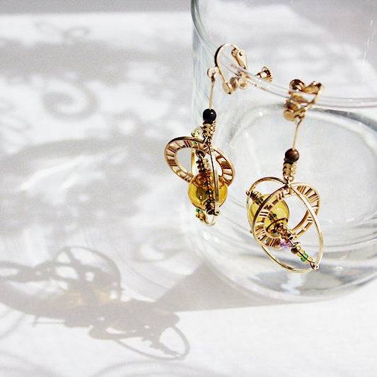 Elegant Planet Saturn Universe Theme Orb Shape Drop Earrings featuring glass orbs and gold-plated bronze, perfect for celestial-themed jewelry lovers.