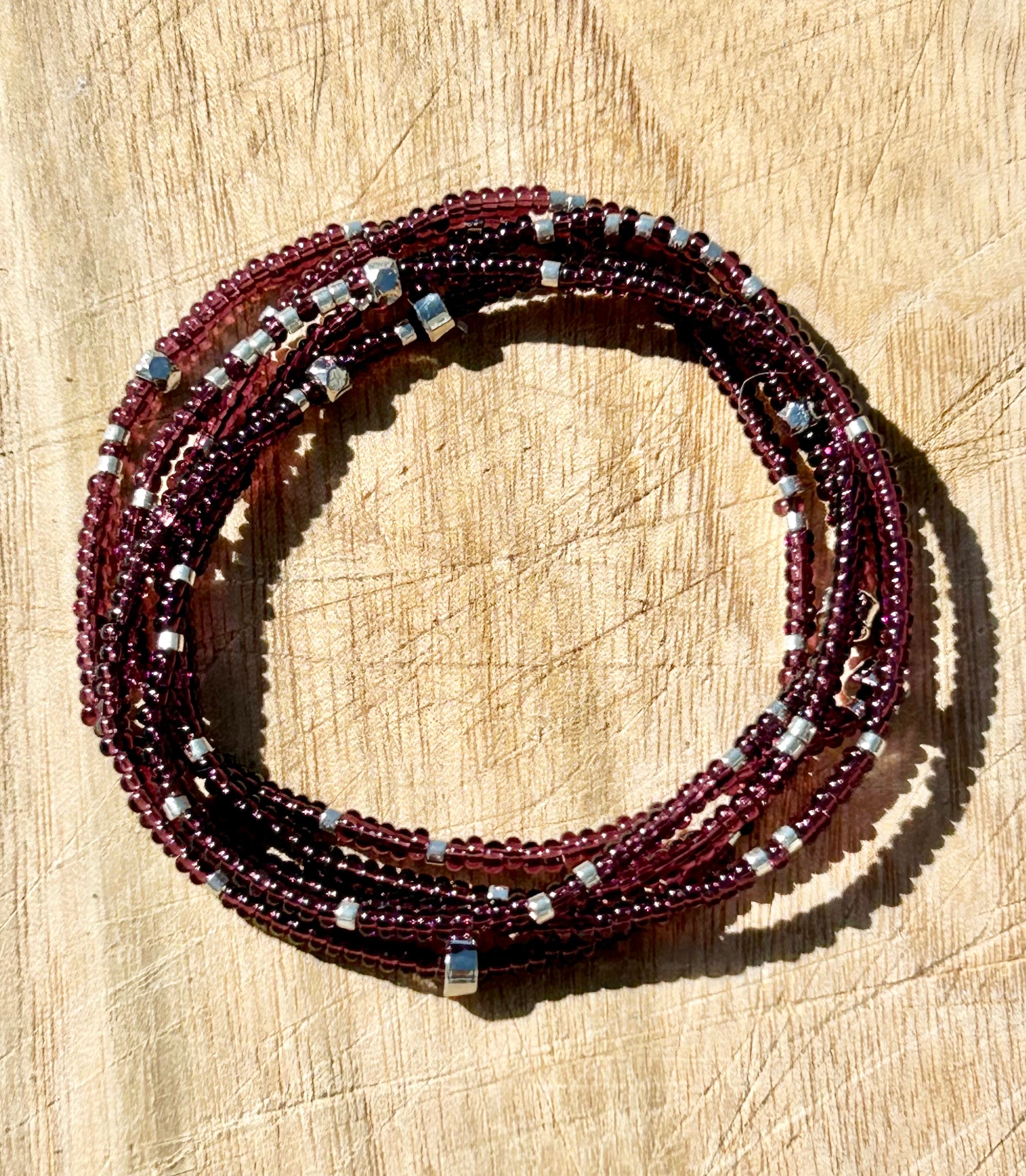 Plum purple beaded 5-wrap bracelet with silver sprinkles, showcasing Czech glass seed beads and strong elastic cording.