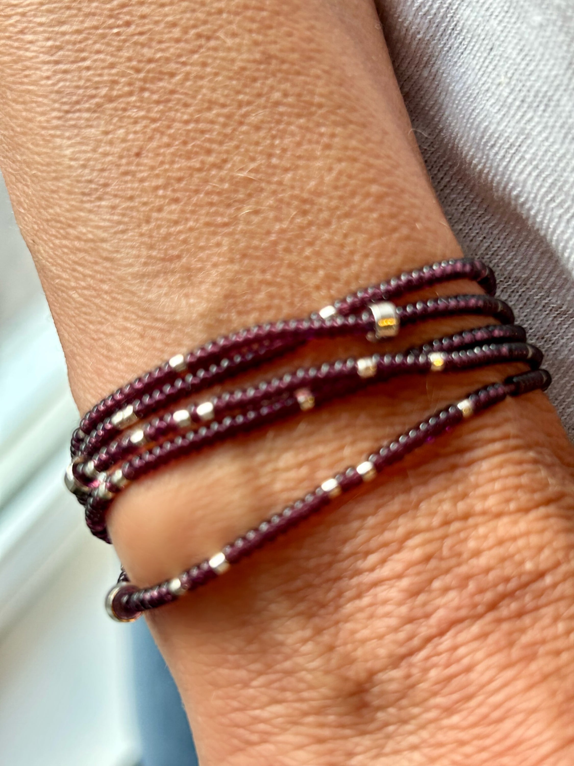 Plum purple beaded 5-wrap bracelet with silver sprinkles, showcasing Czech glass seed beads and strong elastic cording.