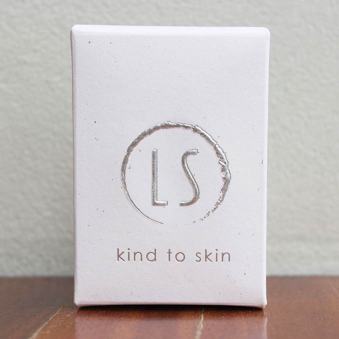 White box with "kind to skin".