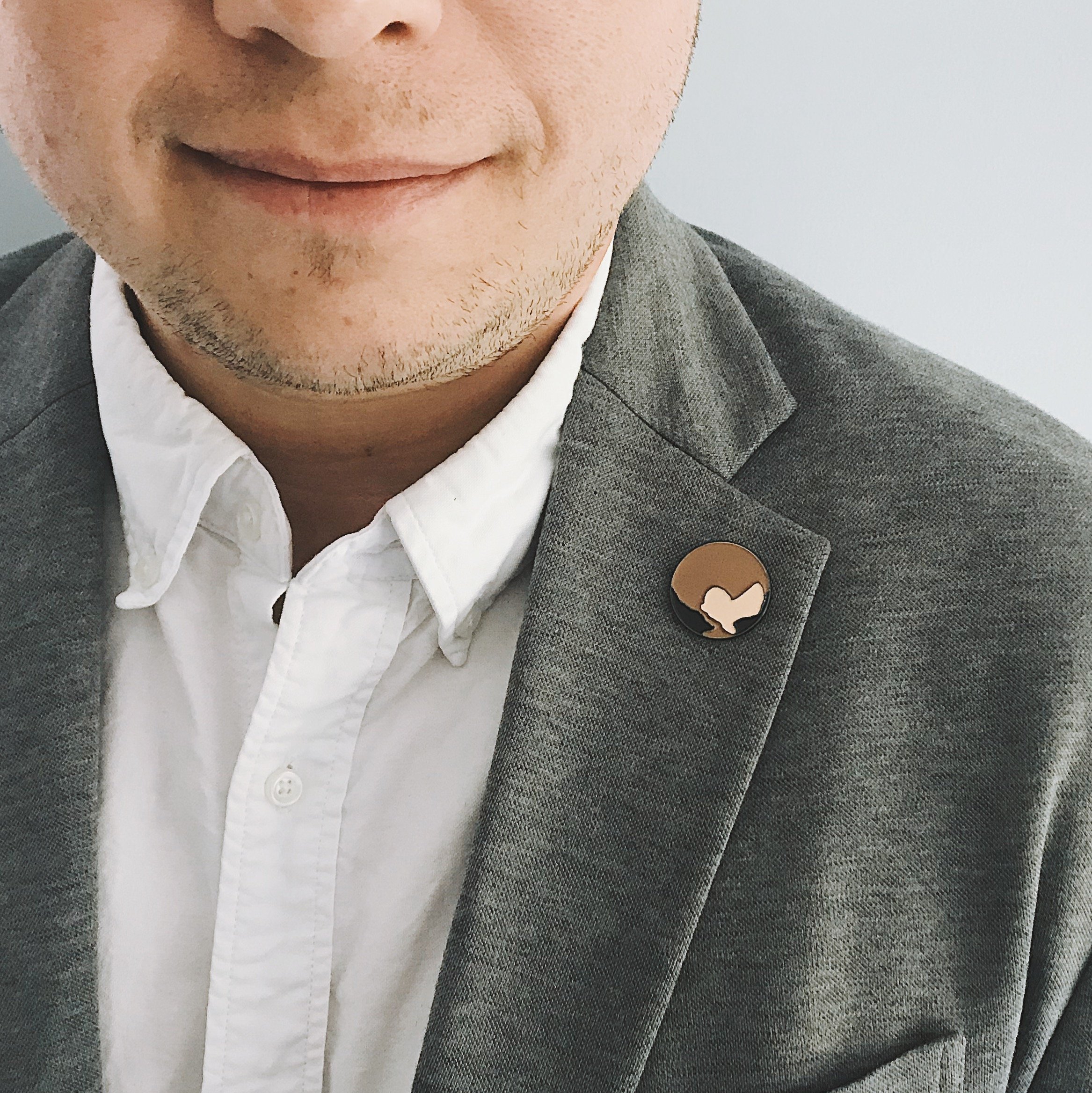 Pluto Enamel Pin featuring a whimsical illustration of Pluto, perfect for jackets and backpacks.