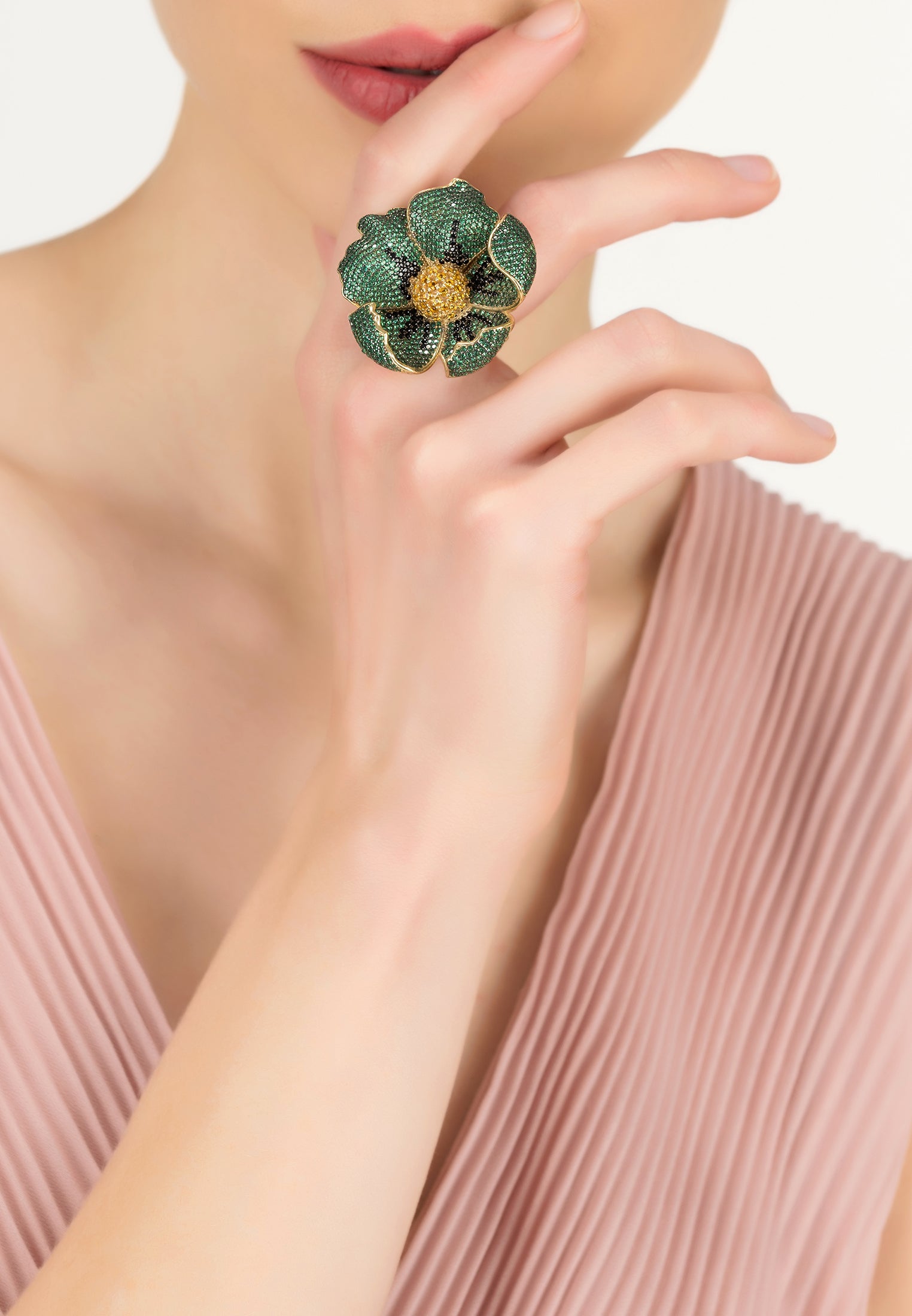 A stunning Poppy Flower Green Ring Gold featuring emerald green and black cubic zirconia, crafted from 925 sterling silver dipped in 22ct gold.