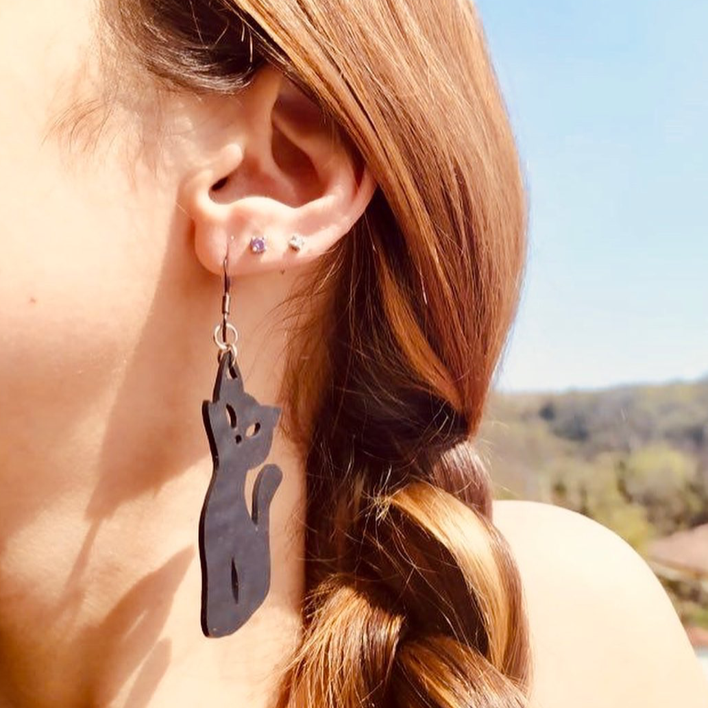 Poppy Recycled Rubber Cat Earrings, handcrafted from recycled inner tubes, featuring unique textures and sterling silver hooks.