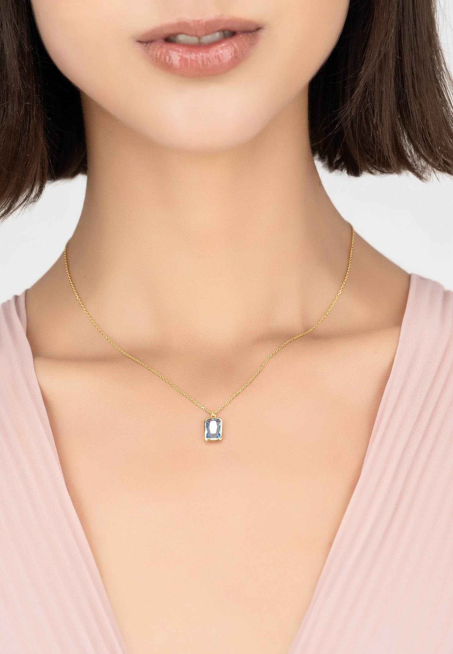 Portofino Necklace featuring a rectangular blue topaz gemstone set in 22ct gold dipped 925 sterling silver, elegantly designed for stylish wear.