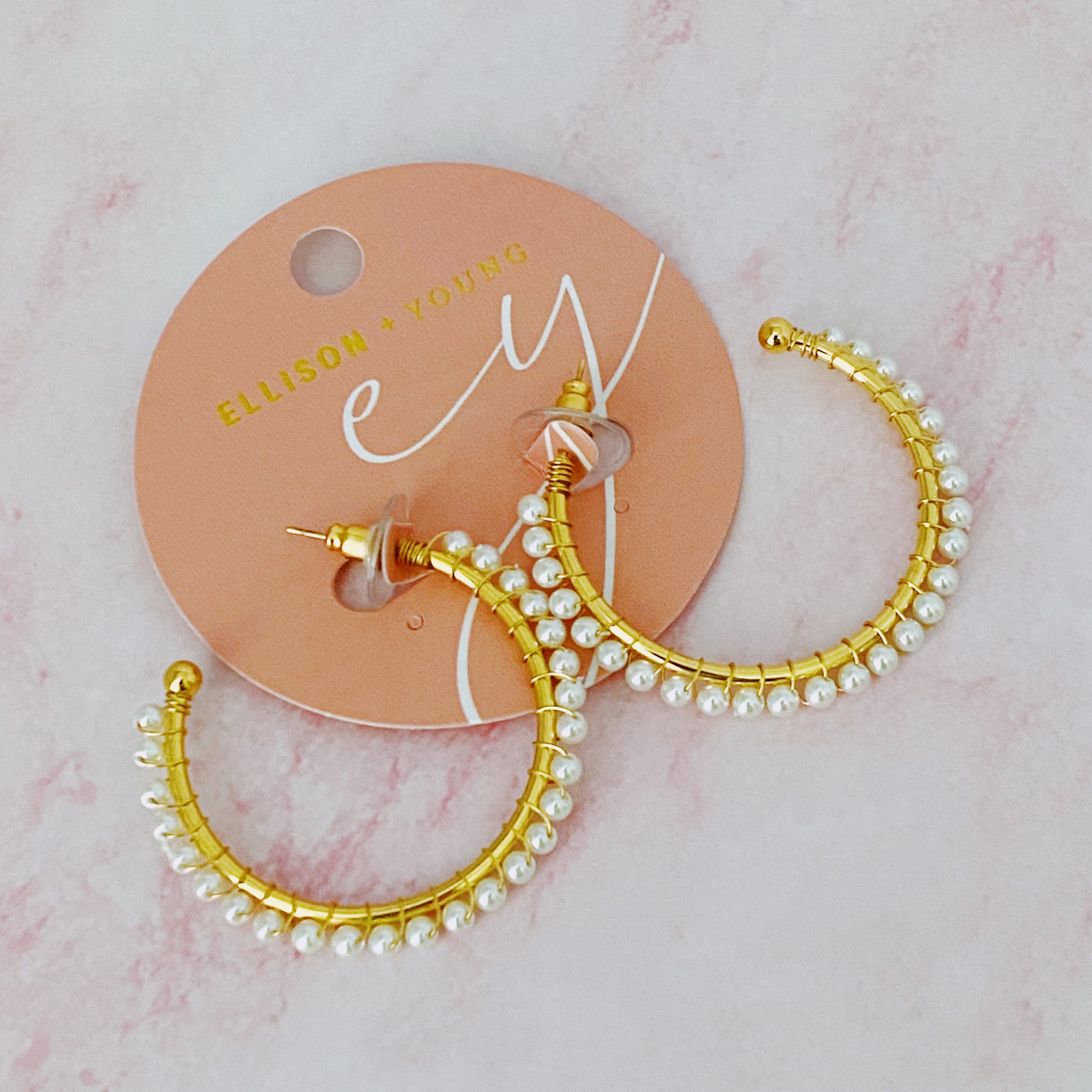 A pair of elegant Precious Pearl Bead Hoop Earrings featuring hand wired pearl beads and 18K gold plated brass, perfect for any occasion.