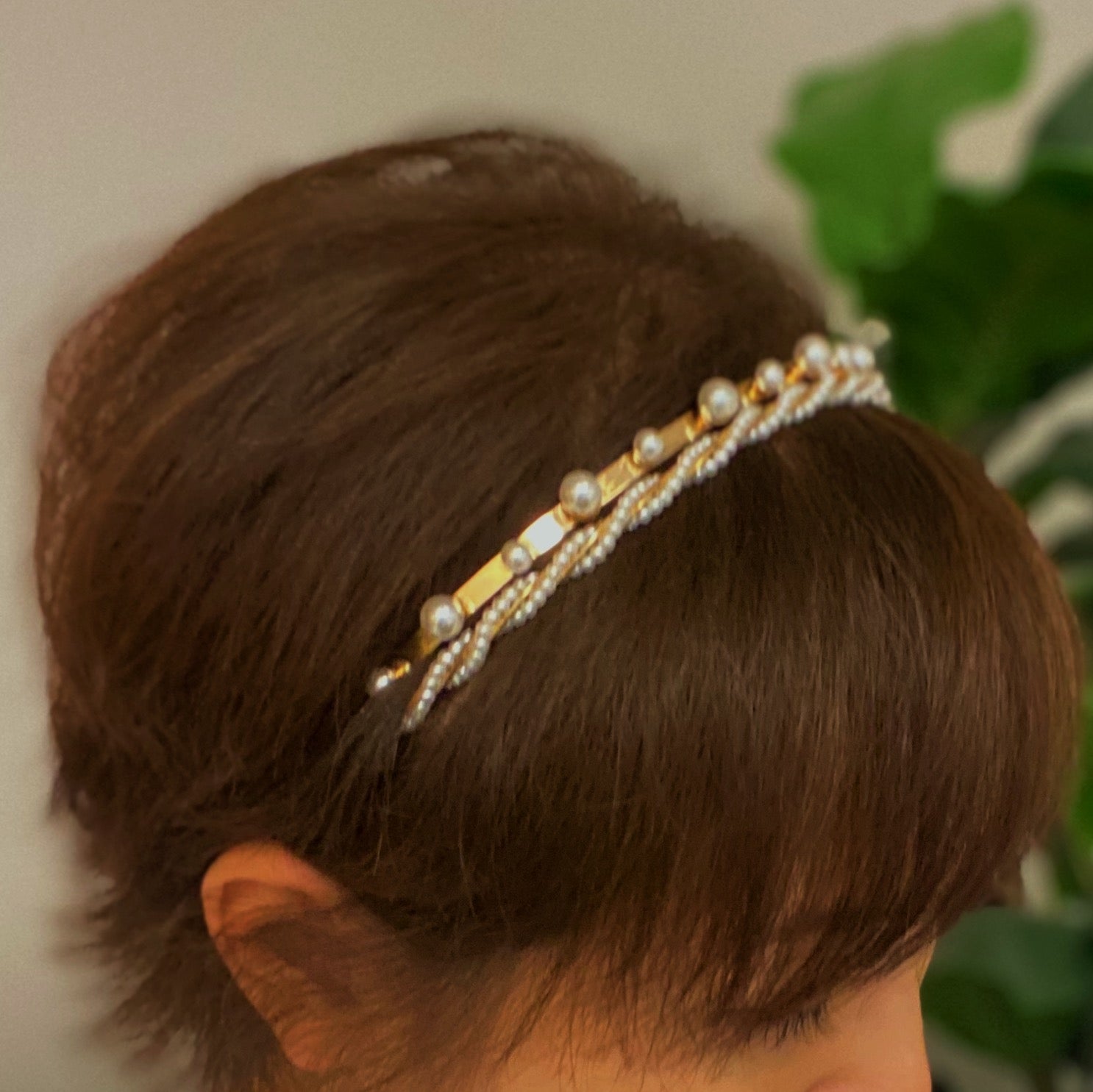 A set of two elegant pearl headbands, showcasing distinct designs and luxurious pearl detailing, perfect for any occasion.