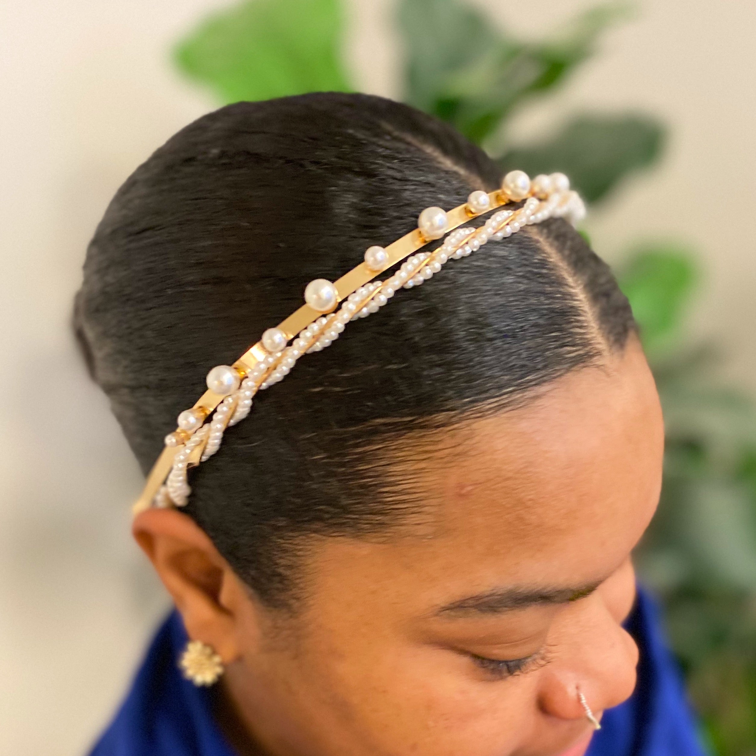 A set of two elegant pearl headbands, showcasing distinct designs and luxurious pearl detailing, perfect for any occasion.