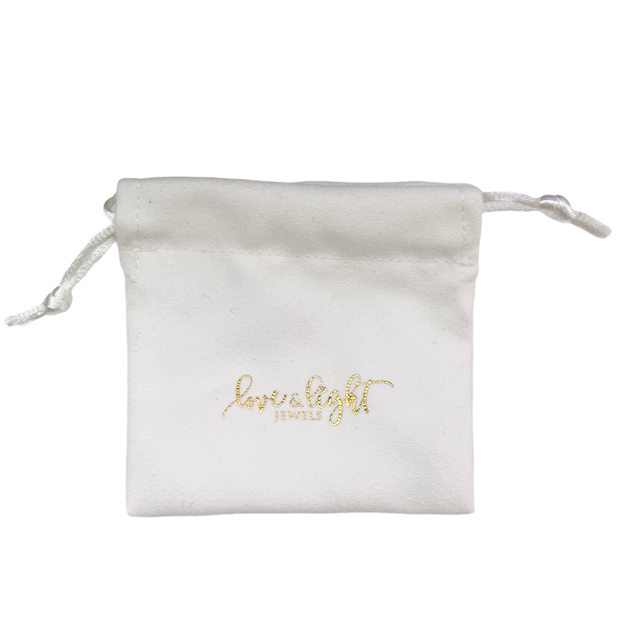 Premium velvet drawstring pouch in various colors, ideal for storing jewelry and small crystals.