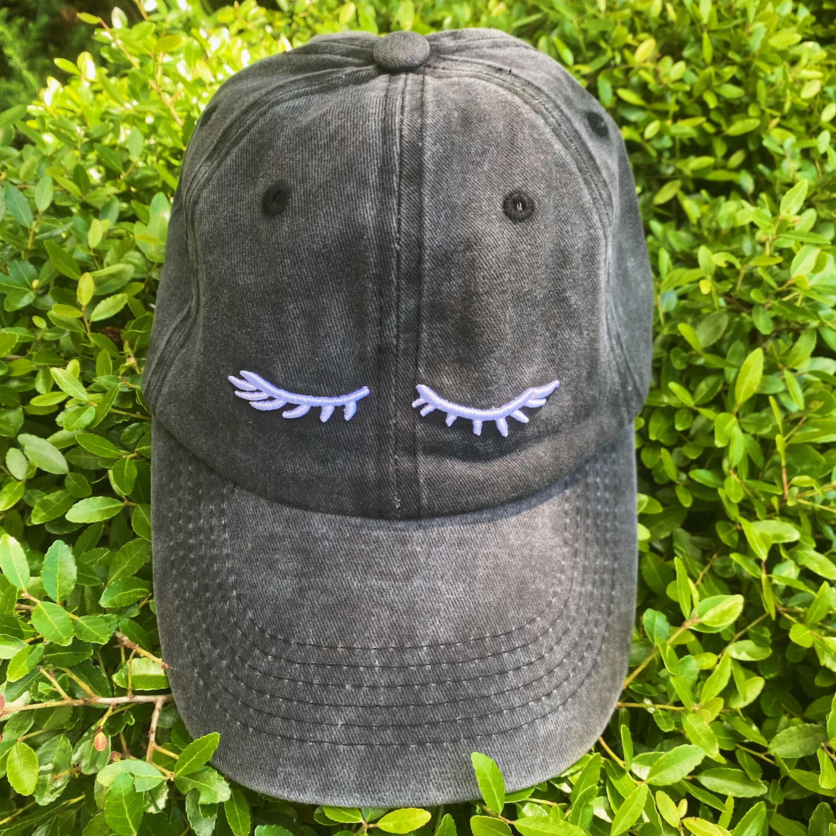 Pretty Eyelash Ball Cap featuring 3D embroidery on a washed cotton fabric, showcasing a stylish curved brim and adjustable strap.