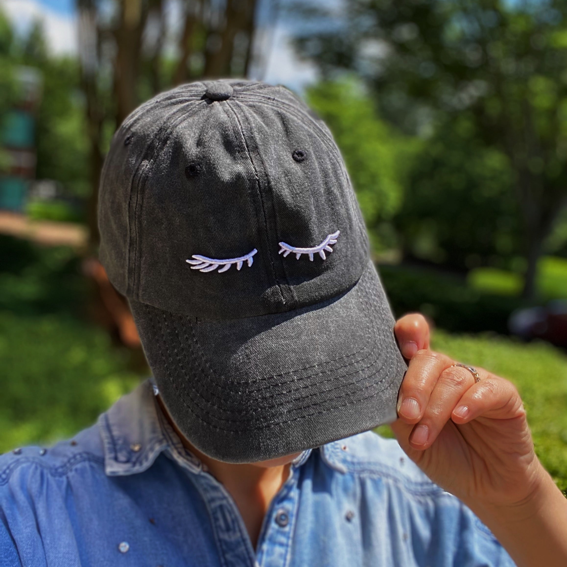 Pretty Eyelash Ball Cap featuring 3D embroidery on a washed cotton fabric, showcasing a stylish curved brim and adjustable strap.