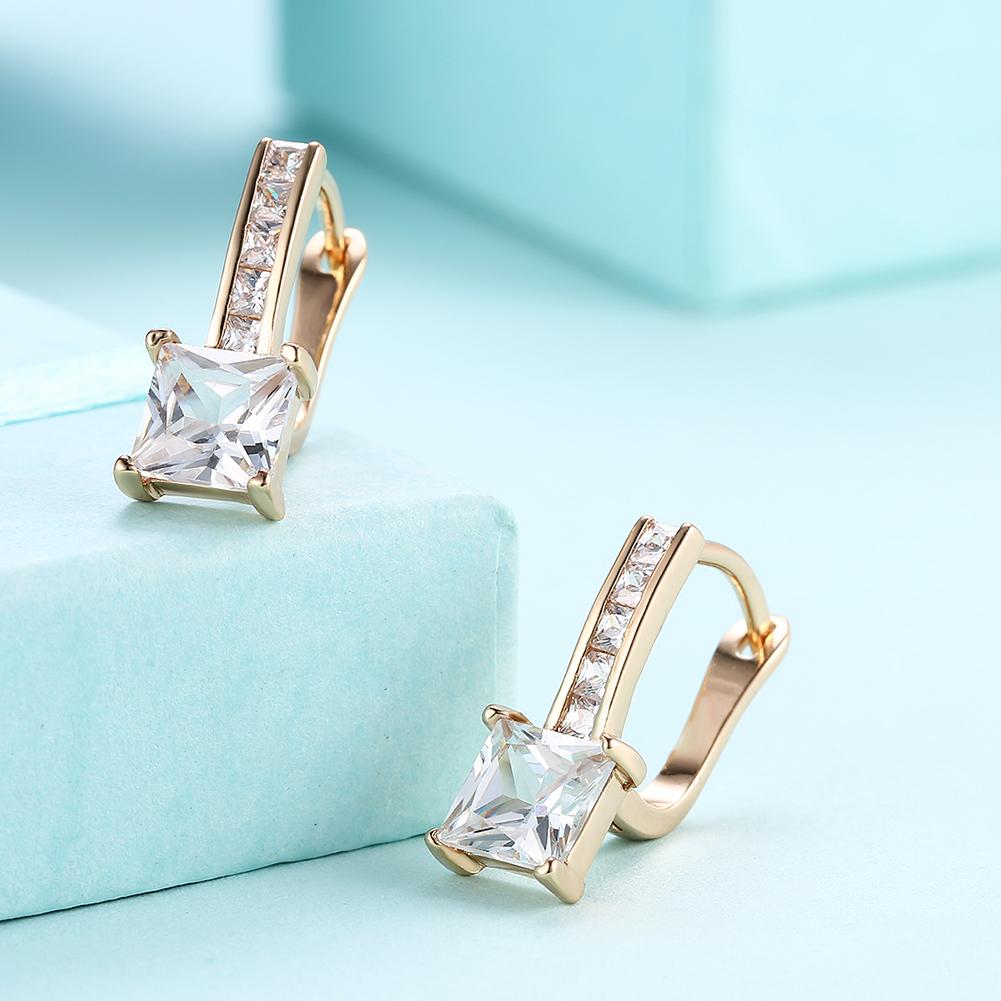 Elegant Princess Cut Pav'e Elements earrings in 14K gold with certified crystals, showcasing a luxurious design and hypoallergenic features.