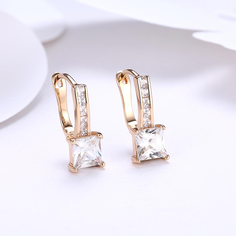 Elegant Princess Cut Pav'e Elements earrings in 14K gold with certified crystals, showcasing a luxurious design and hypoallergenic features.