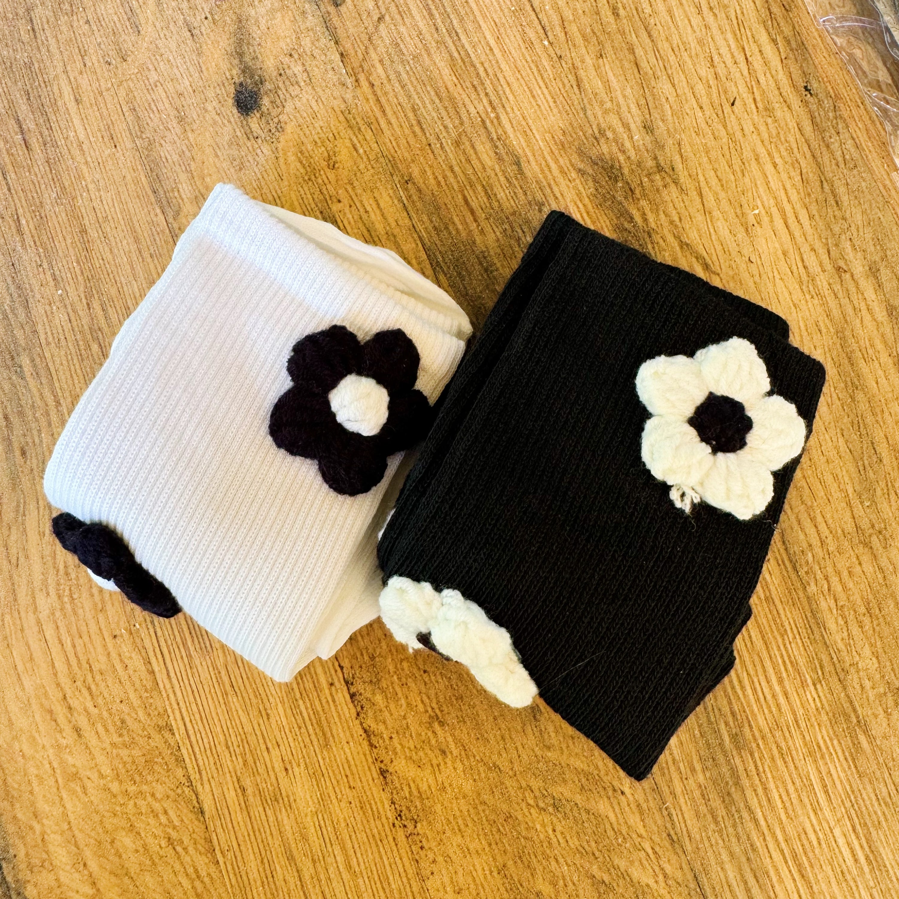 Puffy Daisy Embellished Socks Set of 2 featuring a chic black and white design with delicate flower embellishments, perfect for stylish outfits.