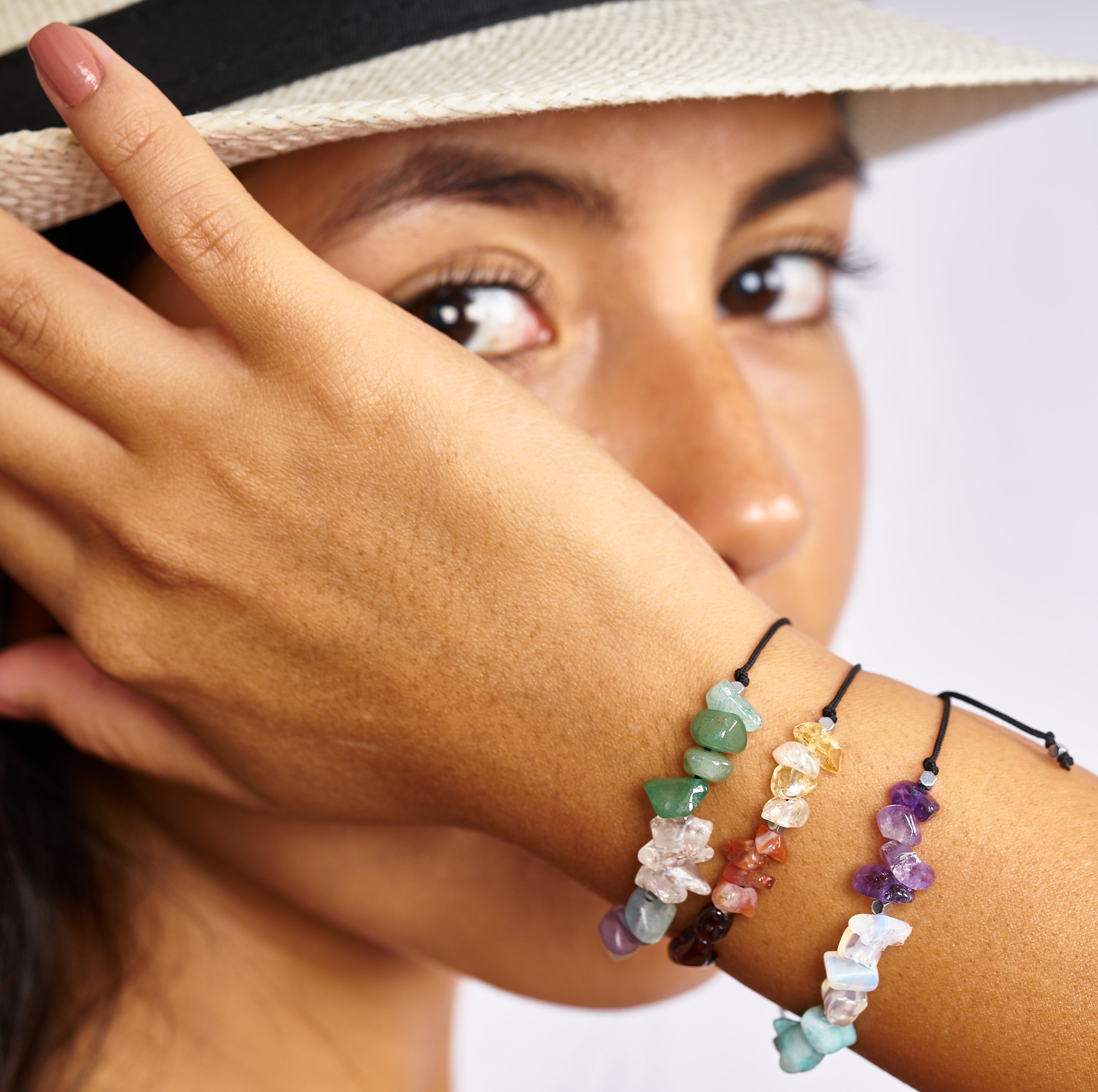 Woman wearing bracelets and hat