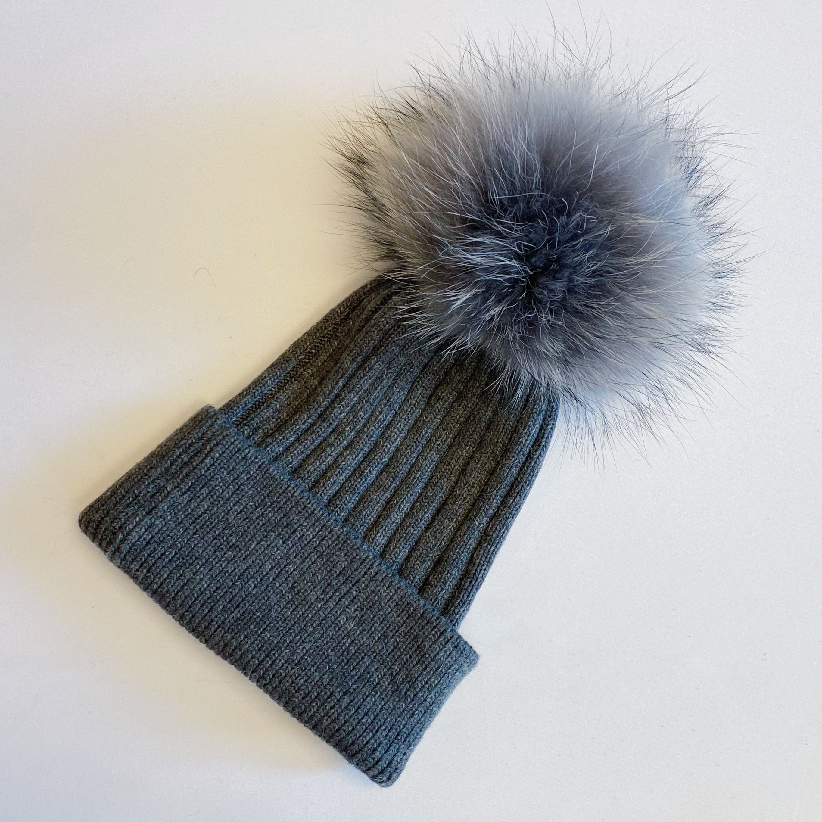 Luxurious Pure Angora Genuine Fur Luxe Beanie with raccoon fur pom pom, showcasing a soft knit design in a stylish fold-over style.