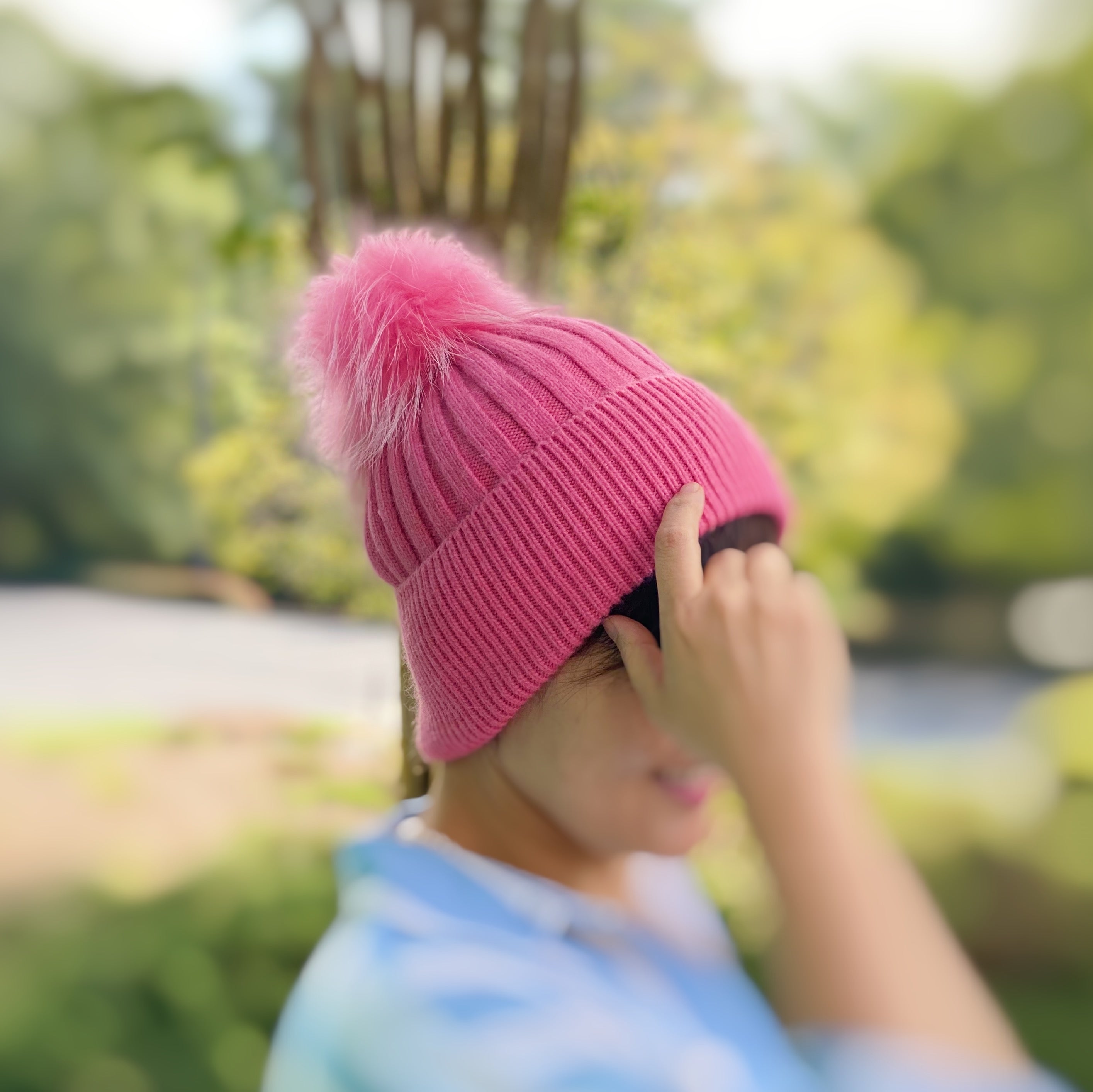 Luxurious Pure Angora Genuine Fur Luxe Beanie with raccoon fur pom pom, showcasing a soft knit design in a stylish fold-over style.