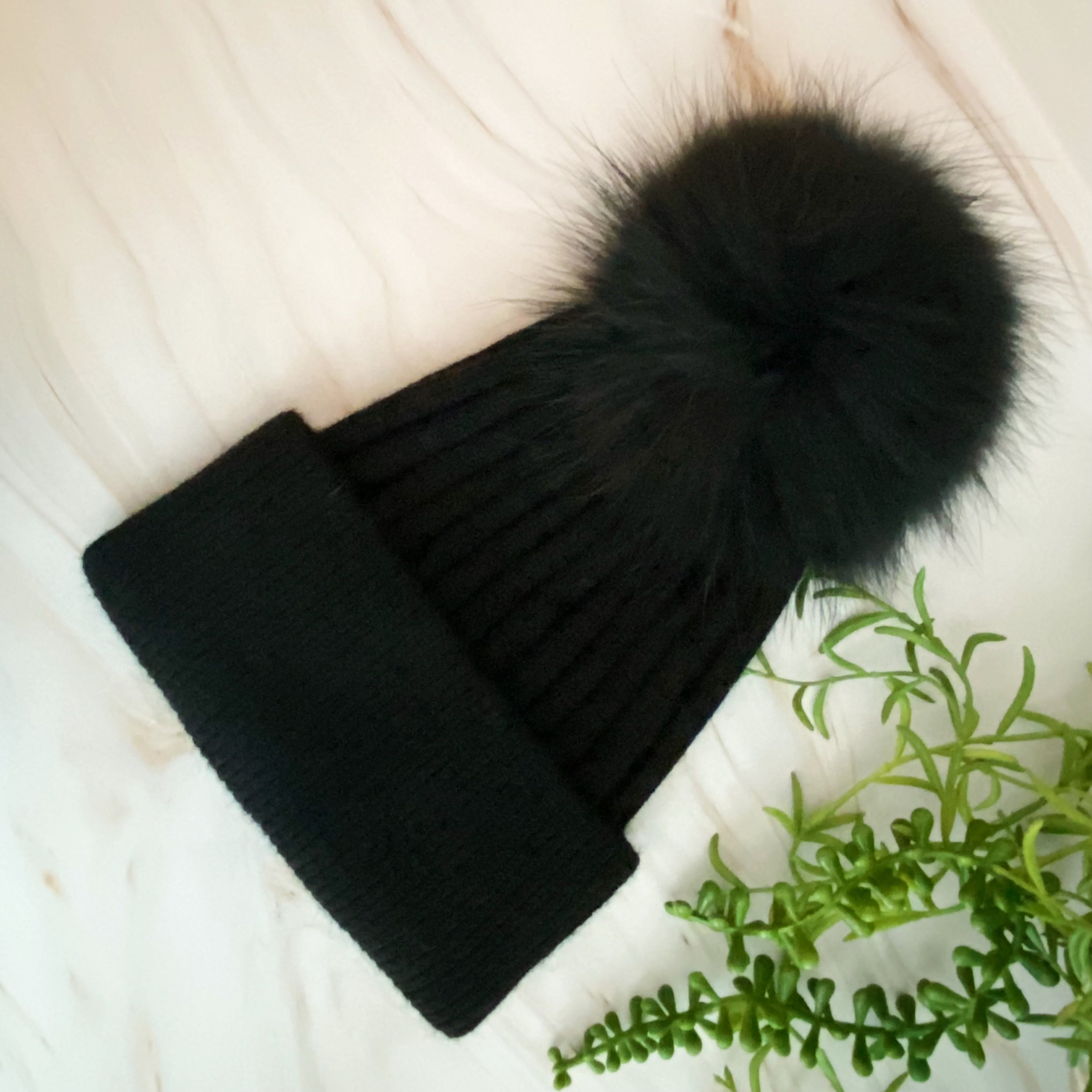 Luxurious Pure Angora Genuine Fur Luxe Beanie with raccoon fur pom pom, showcasing a soft knit design in a stylish fold-over style.