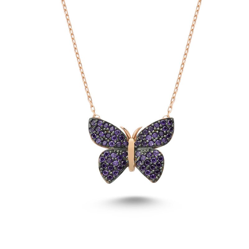 A beautiful Purple Butterfly Silver Necklace featuring a sparkling CZ crystal pendant, handmade from 925 sterling silver with a delicate chain.