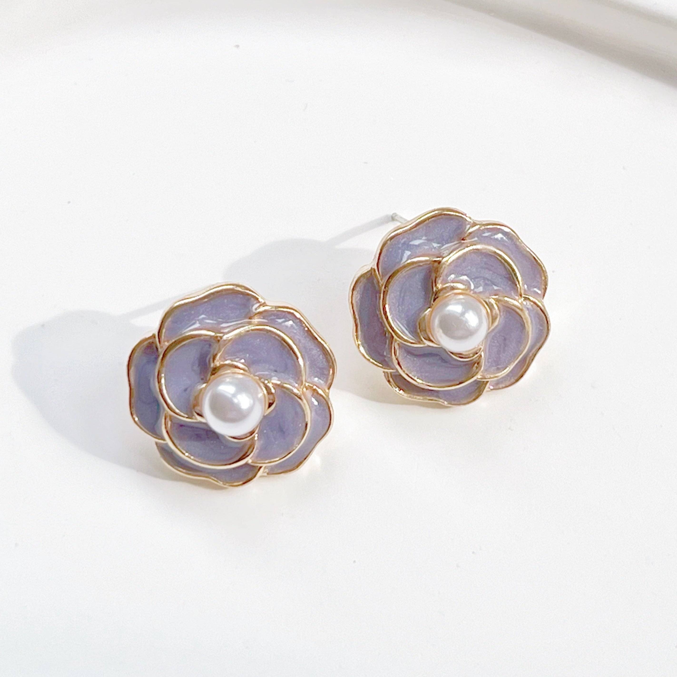 Purple Camellia earrings in flower shape with pearl accents, crafted from sterling silver and gold plated sterling silver.