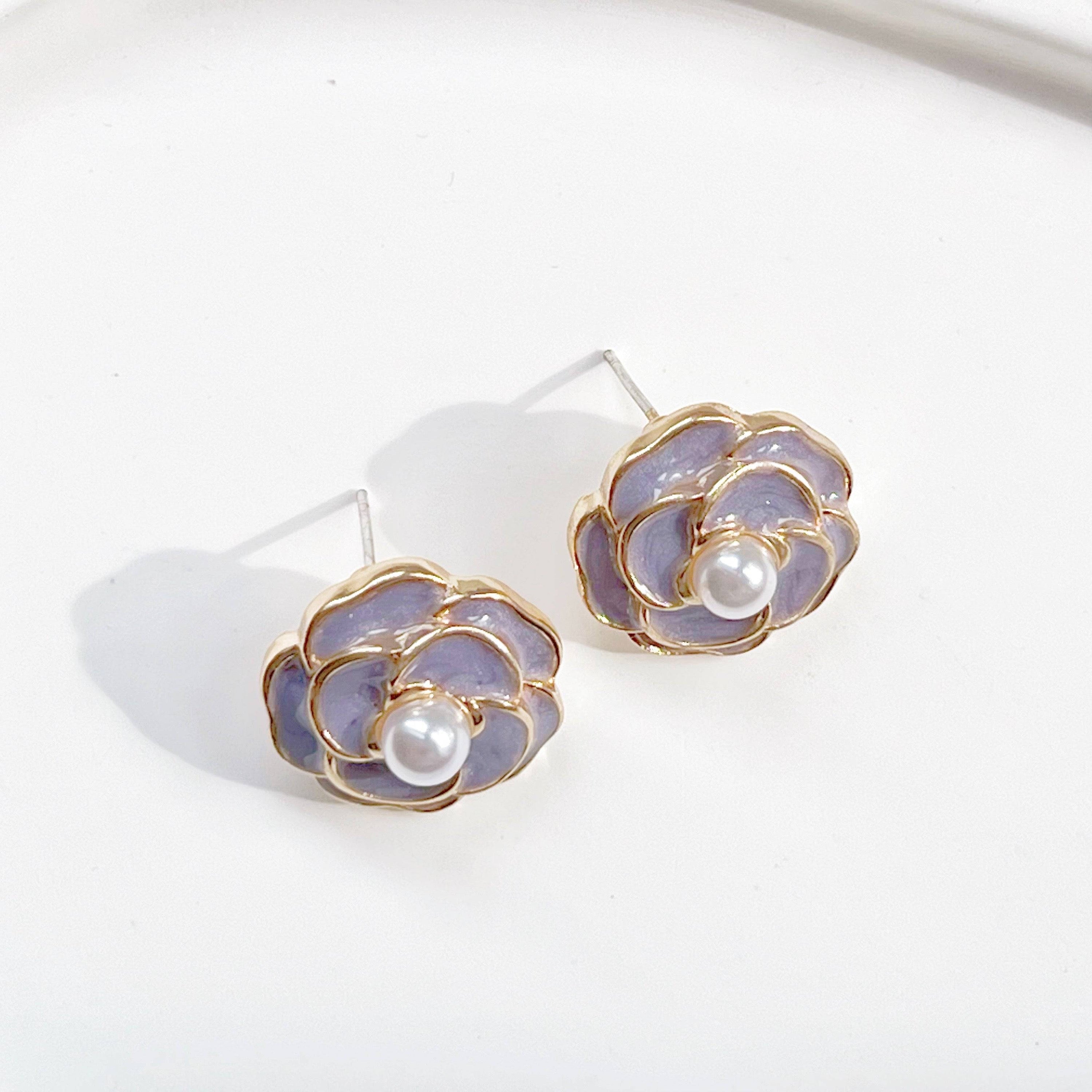 Purple Camellia earrings in flower shape with pearl accents, crafted from sterling silver and gold plated sterling silver.