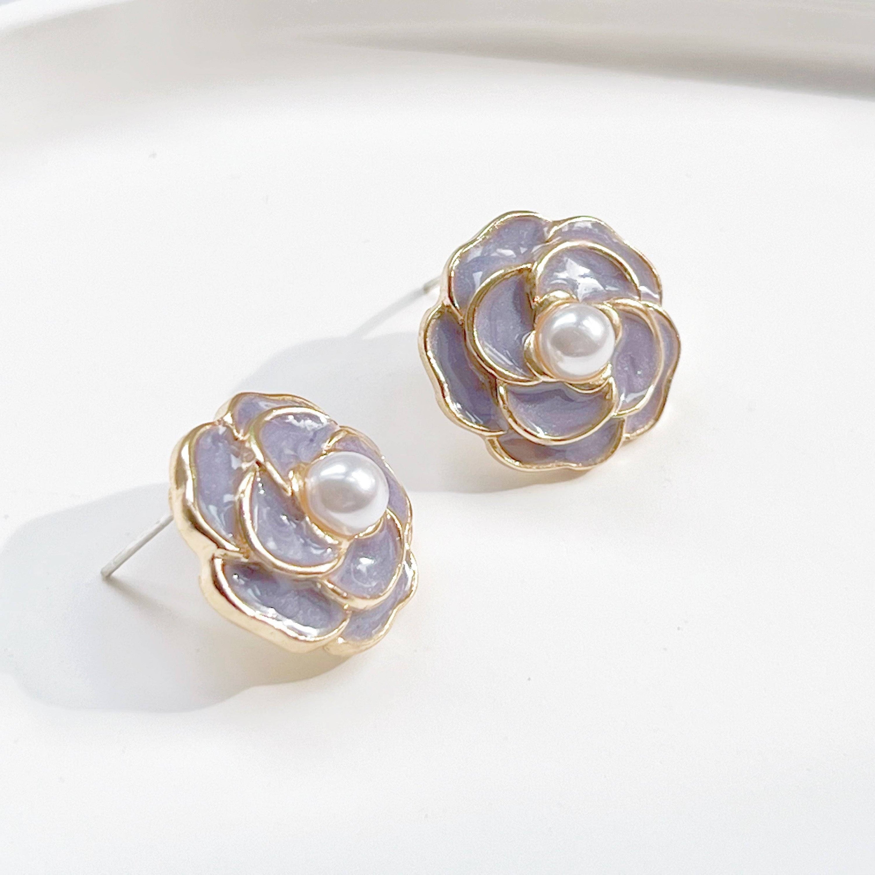 Purple Camellia earrings in flower shape with pearl accents, crafted from sterling silver and gold plated sterling silver.