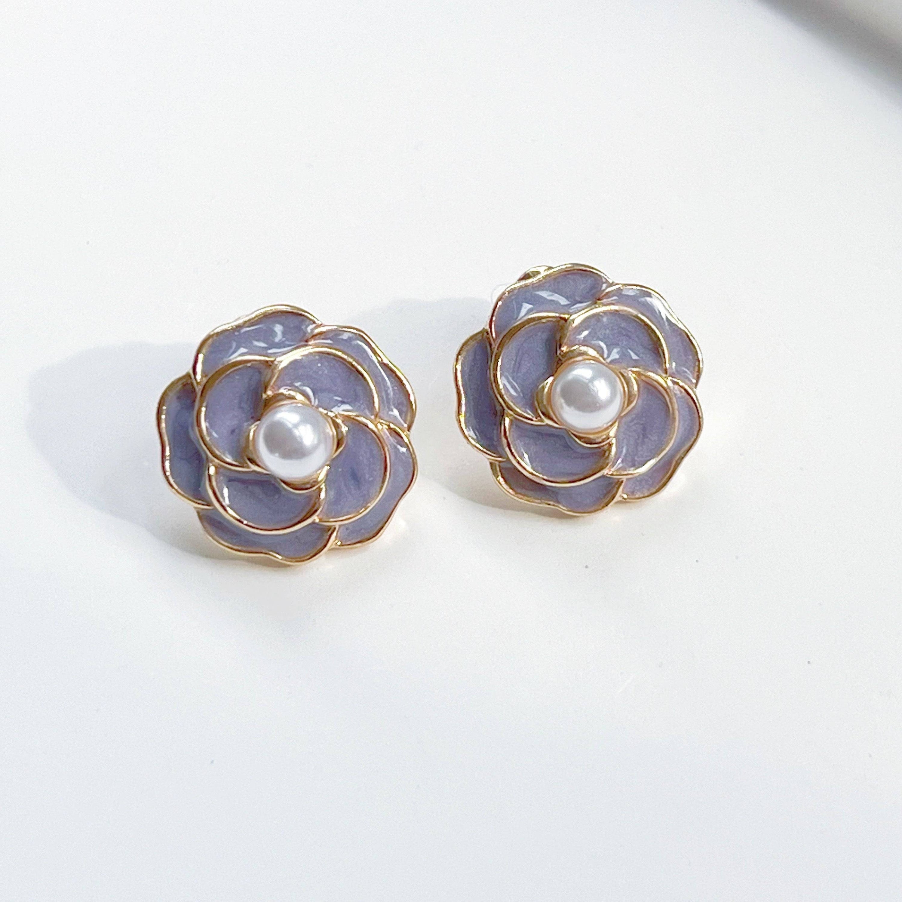 Purple Camellia earrings in flower shape with pearl accents, crafted from sterling silver and gold plated sterling silver.