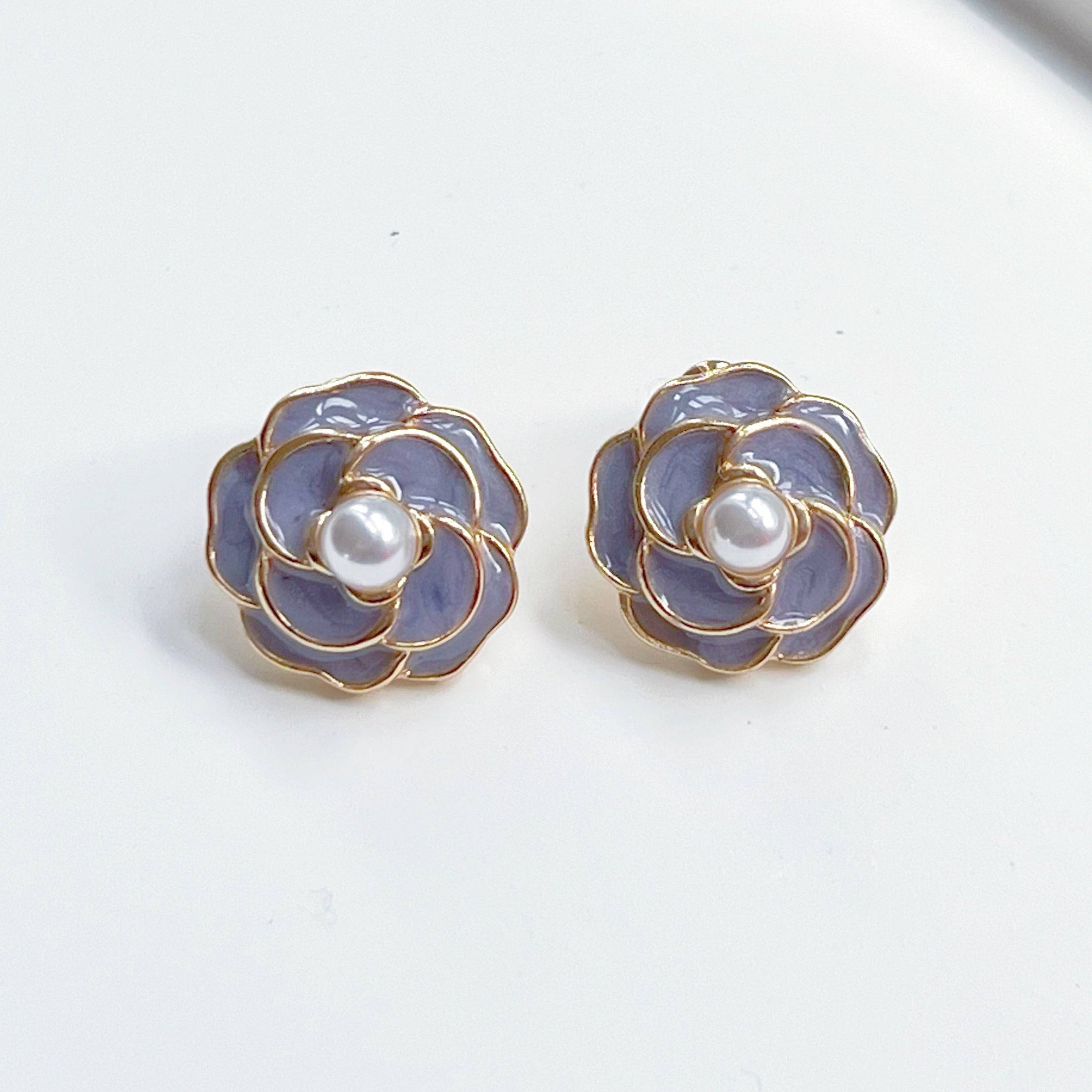 Purple Camellia earrings in flower shape with pearl accents, crafted from sterling silver and gold plated sterling silver.