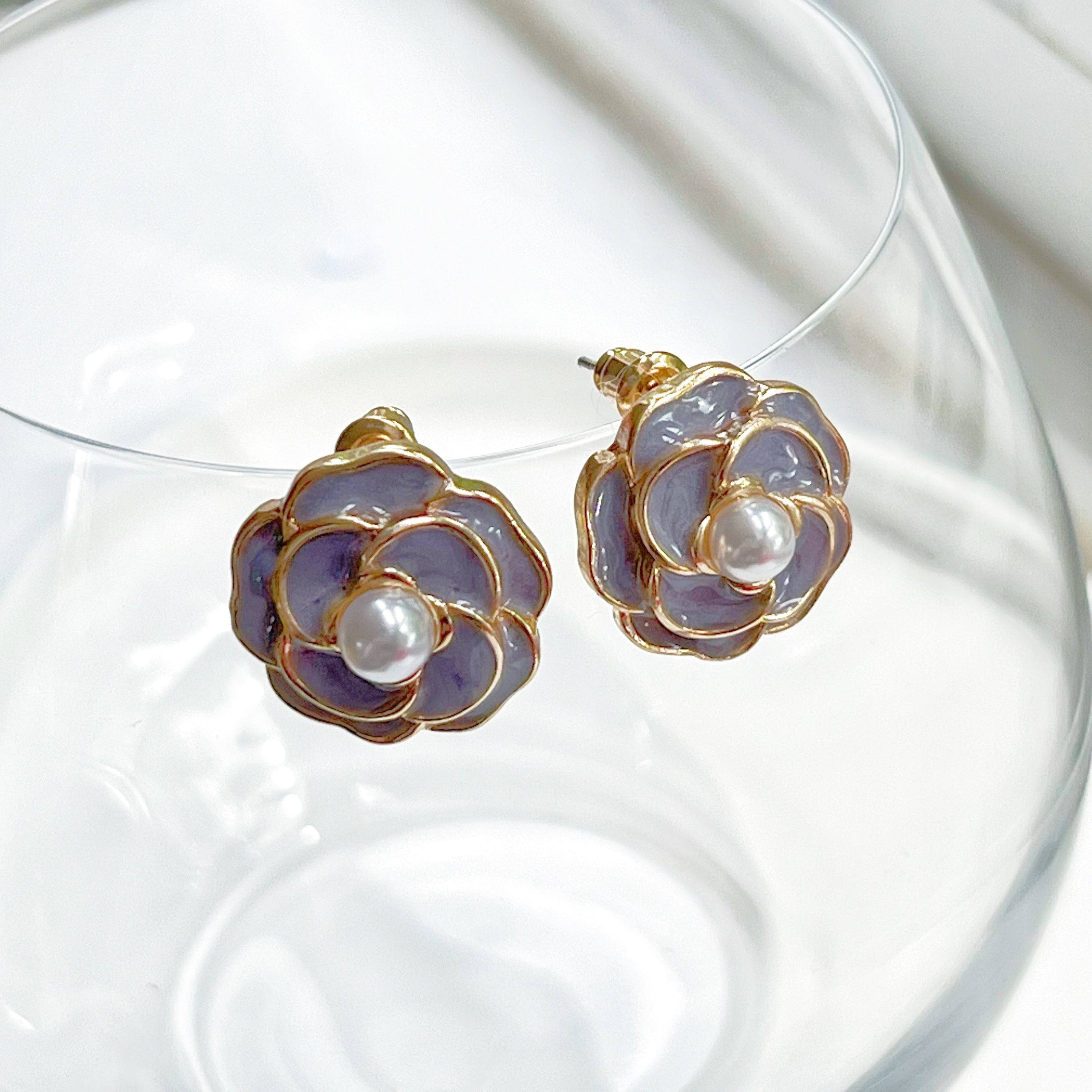 Purple Camellia earrings in flower shape with pearl accents, crafted from sterling silver and gold plated sterling silver.